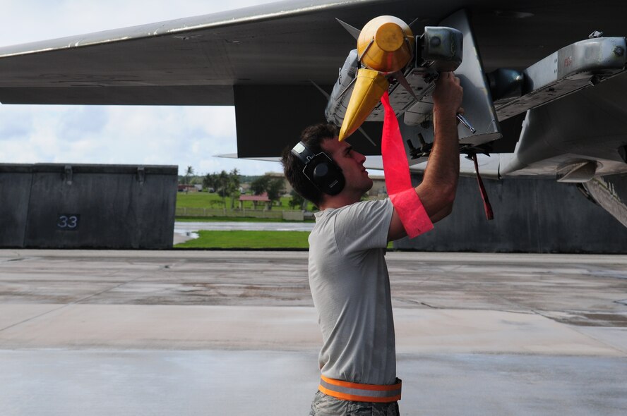 Airman 1st Class Timothy Emeric, a 67th Aircraft Maintenance Unit weapons loader deployed to Andersen Air Force Base, Guam, loads a missile onto a Kadena F-15.
(U.S. Air Force Photo/Tech. Sgt. Mike Tateishi)