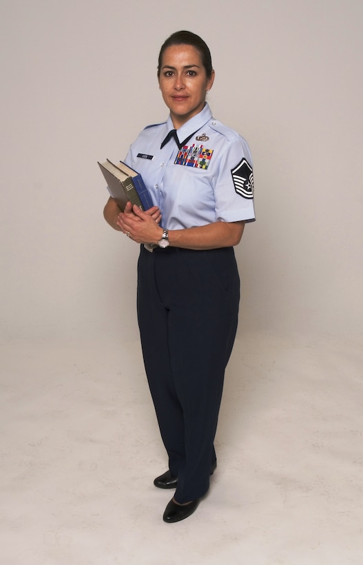 Master Sgt. Elisa Giese, 412th Test Wing Command Section superintendent, is an education mentor to six enlisted Airmen. Sergeant Giese is participating in Edwards' AFB Year of the Community College of the Air Force initiative that encourages its noncommissioned officers through senior NCOs to accomplish their CCAF degree requirements, such as English, math, speech, social science and humanities. (U.S. Air Force photo/Edward Cannon)