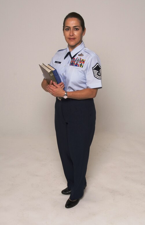 Master Sgt. Elisa Giese, 412th Test Wing Command Section superintendent, is an education mentor to six enlisted Airmen. Sergeant Giese is participating in Edwards' AFB Year of the Community College of the Air Force initiative that encourages its noncommissioned officers through senior NCOs to accomplish their CCAF degree requirements, such as English, math, speech, social science and humanities. (U.S. Air Force photo/Edward Cannon)