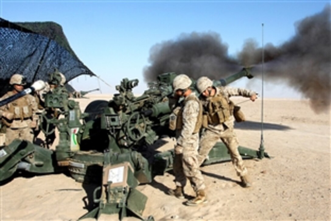 Smoke erupts as U.S. Marines fire a M777 howitzer near Camp Buehring, Kuwait, Sept. 1, 2009. The Marines are assigned to Sierra Battery, Battalion Landing Team, 3rd Battalion, 2nd Marine Regiment, 22nd Marine Expeditionary Unit. The unit is ashore in Kuwait conducting sustainment training while serving as the reserve force for U.S. Central Command.