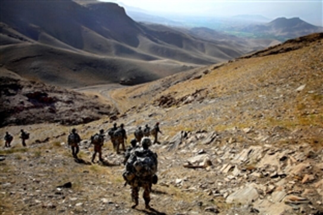 U.S. Army soldiers travel down a mountain during a dismounted patrol next to the Tangi Valley in the Wardak province, Afghanistan, Aug. 30, 2009.