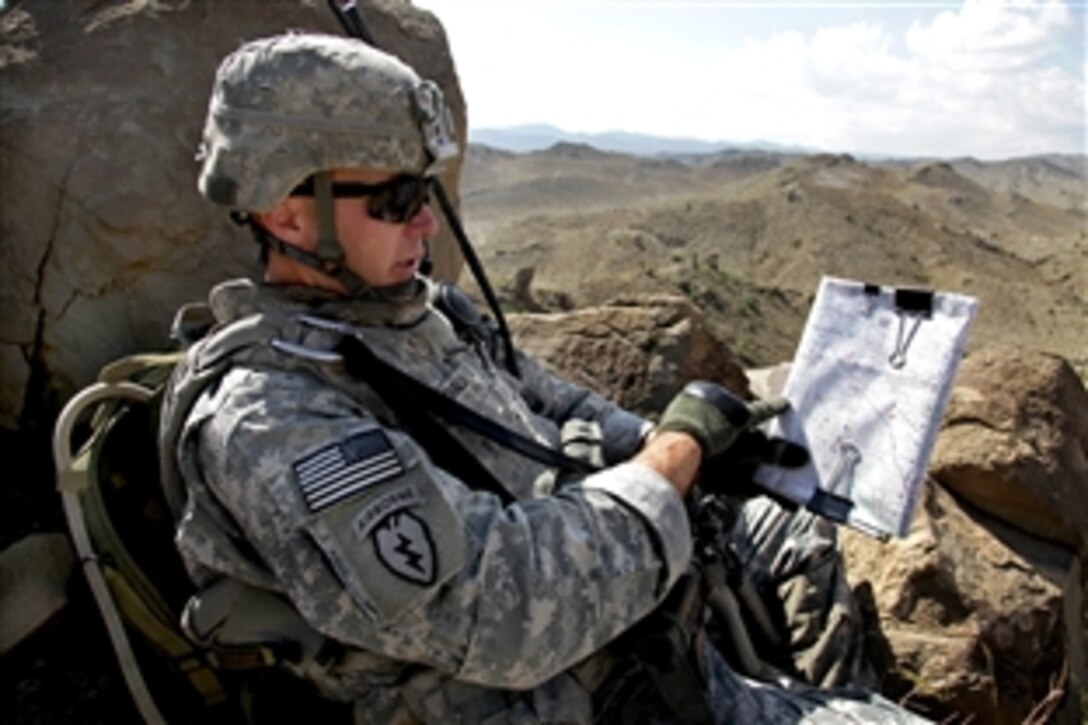 U.S. Army Capt. Gary McDonald checks a map while on a patrol in the mountains near Sar Howza in Paktika province, Afghanistan, Sept. 2, 2009. McDonald is a commander assigned to the 1st Squadron, 40th Cavalry Regiment.
