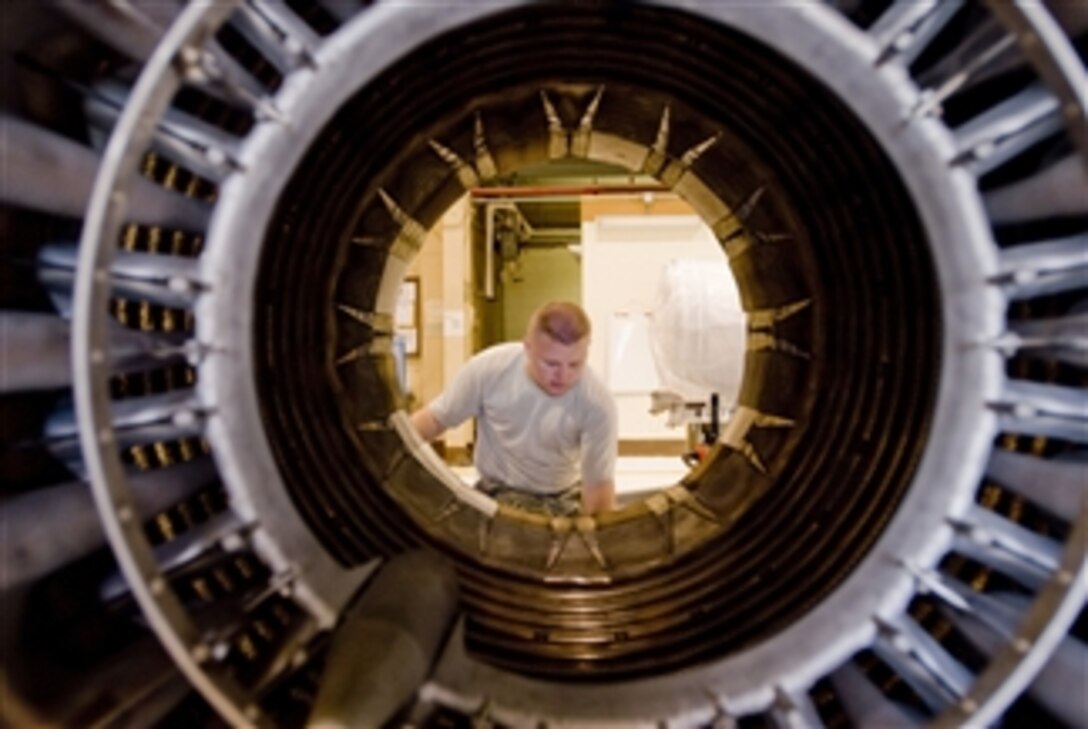 U.S. Air Force Senior Airman Chace Eck, of the 8th Maintenance Squadron, checks out an F-16 Fighting Falcon aircraft engine at Kunsan Air Base, Republic of Korea, on Sept. 2, 2009.  Eck, an aerospace propulsion journeyman assigned to the propulsion flight, provides and services engines to allow continuous flying operations.  