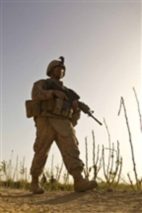 A U.S Marine with Headquarters and Support Company, 1st Battalion, 5th Marine Regiment conducts a census patrol in the Nawa district of the Helmand province of Afghanistan on Sept. 5, 2009.  Census patrols are conducted to help build positive relationships with the local population.  The 1st Battalion, 5th Marine Regiment is deployed with Regimental Combat Team 3 to conduct counterinsurgency operations in partnership with Afghan National Security Forces in southern Afghanistan.  