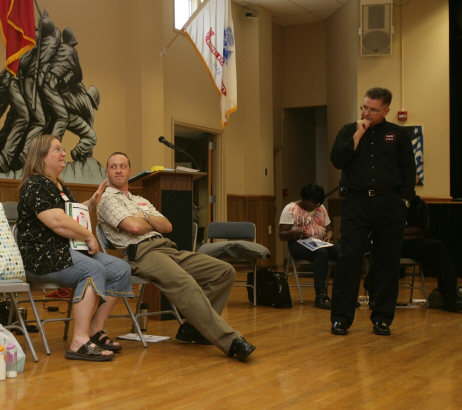 Jacky Oehring, wife of Petty Officer First Class Norman Oehring, comments on issues with communication during a marriage enrichment seminar held for the couples from the 26 Marine Expeditionary Unit at the Jacksonville USO, Sept. 10. Command Chaplain Timothy Powell led the event.