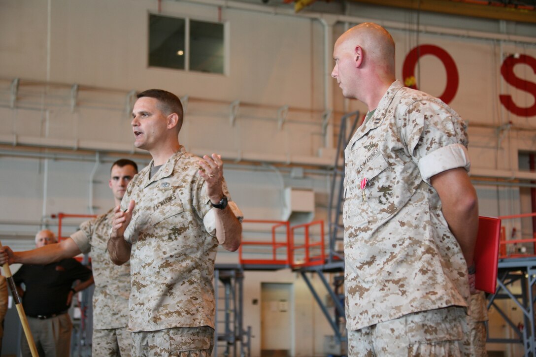 Marine Aircraft Group 14 commanding officer, Col. Russell A. C. Sanborn speaks after awarding the Bronze Star to Capt. Jason N. Dale, a forward air controller with Marine Aerial Refueler Transport Squadron-252, Sept. 9.