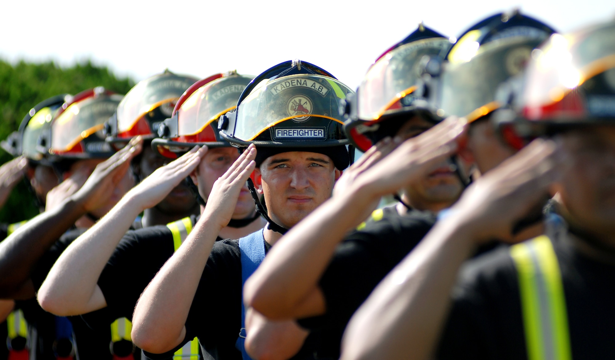 Kadena firefighters salute the American flag during Taps at the 9/11 memorial ceremony near the wing building here. Kadena Airmen acknowledged those who risked their lives to save the victims of the tragic events of September 11, 2001. The ceremony also paid tribute to the men and women of the U.S. Armed Forces who have served in the military whether deployed or at home station since these events.
(U.S. Air Force photo/Tech. Sgt. Reynaldo Ramon) 




