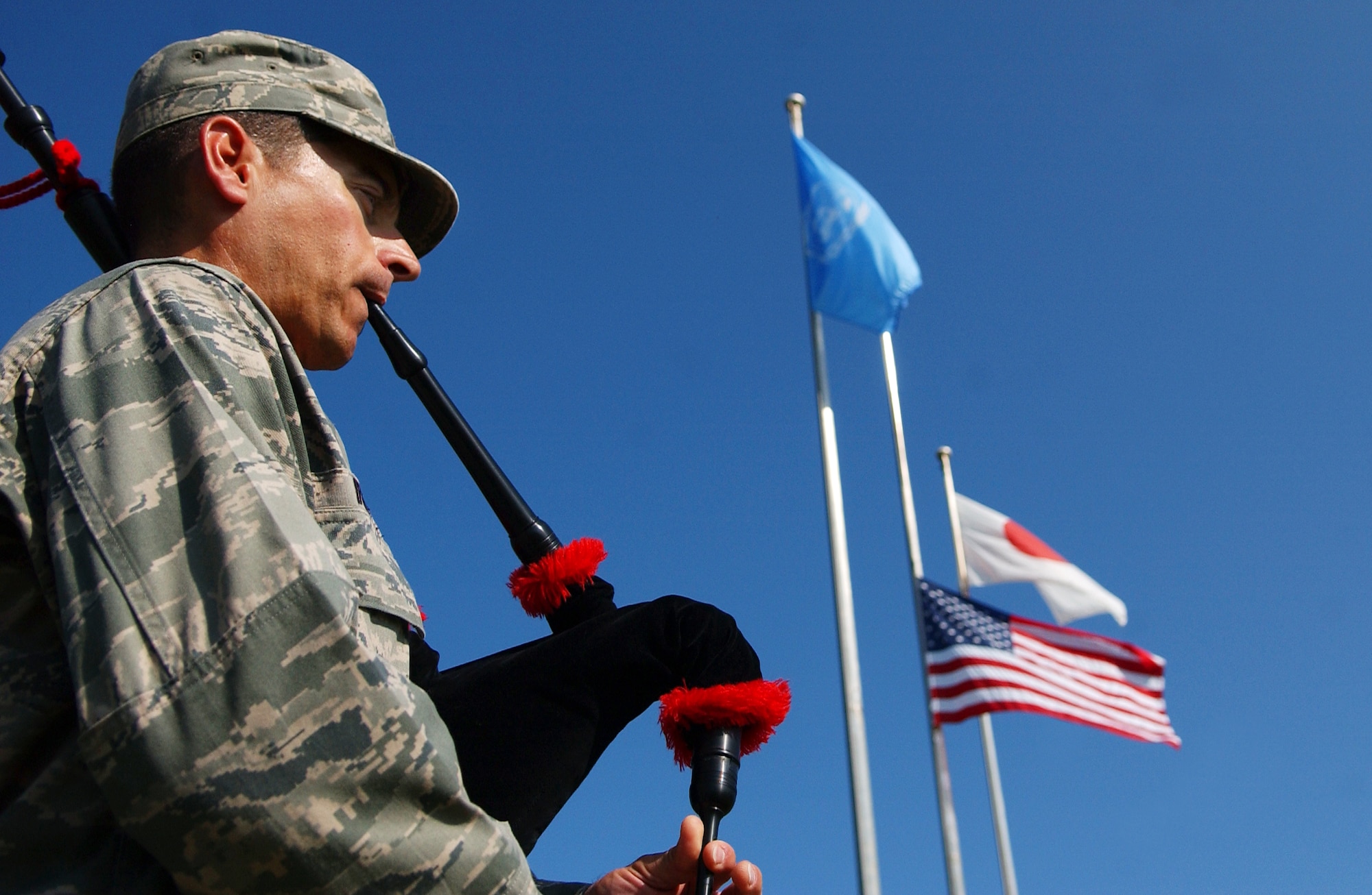 Maj. Chris Iriarte, 18th Equipment Maintenance Squadron, plays the bagpipes during the 9/11 memorial ceremony here. Kadena Airmen acknowledged those who risked their lives to save the victims of the tragic events of September 11, 2001. The ceremony also paid tribute to the men and women of the U.S. Armed Forces who have served in the military whether deployed or at home station since these events.
(U.S. Air Force photo/Tech. Sgt. Reynaldo Ramon) 



