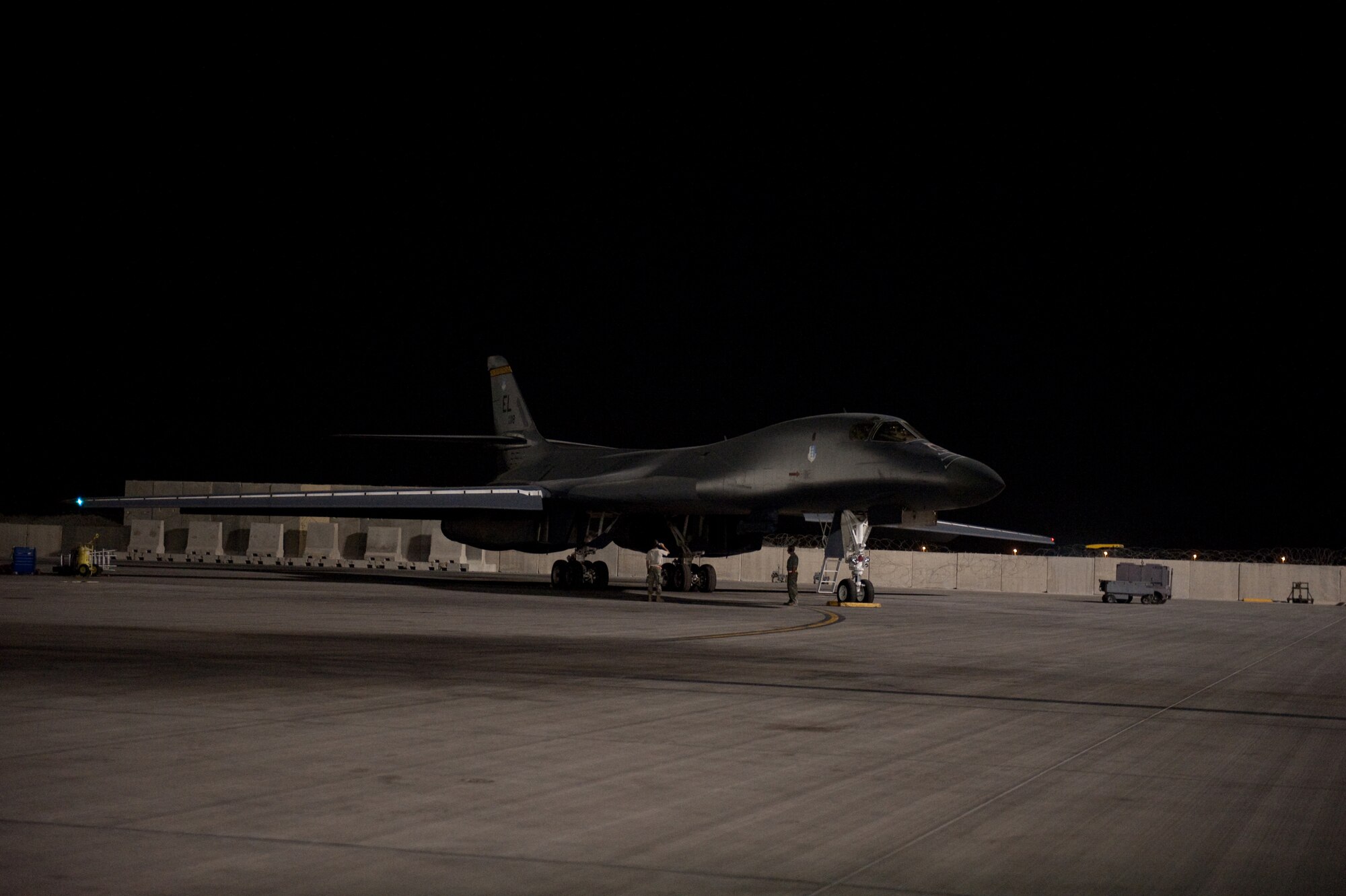 A B-1B Lancer aircrew from the 37th Expeditionary Bomb Squadron prepares to fly a sortie, Sept. 3, in Southwest Asia. Carrying the largest payload of both guided and unguided weapons in the Air Force inventory, the multi-mission B-1 is the backbone of America's long-range bomber force. It can rapidly deliver massive quantities of precision and non-precision weapons against any adversary, anywhere in the world, at any time. (U.S. Air Force photo/Staff Sgt. Robert Barney)