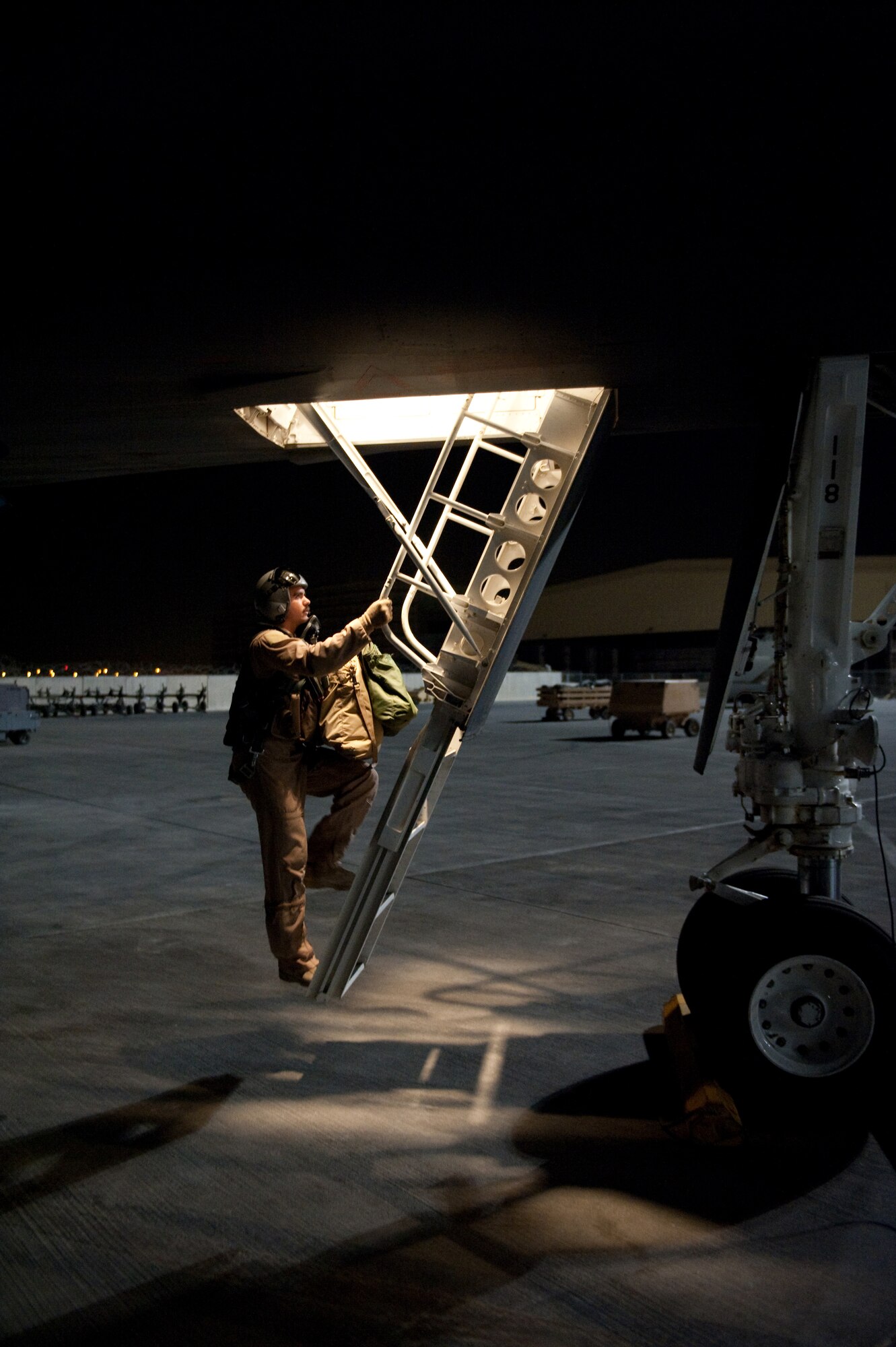 Capt. David Grasso, 37th Expeditionary Bomb Squadron B-1B Lancer pilot, climbs aboard a B-1 as he begins a sortie, Sept. 2, in Southwest Asia. Carrying the largest payload of both guided and unguided weapons in the Air Force inventory, the multi-mission B-1 is the backbone of America's long-range bomber force. It can rapidly deliver massive quantities of precision and non-precision weapons against any adversary, anywhere in the world, at any time. Captain Grasso is deployed from Ellsworth Air Force Base, S.D. in support of Operations Iraqi and Enduring Freedom. (U.S. Air Force photo/Staff Sgt. Robert Barney)