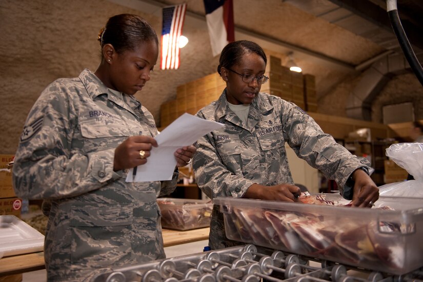Left, Staff Sgt. Tynesha Branch and Tech. Sgt. Karen Fish, 379th Blood Transshipment Center personnel, prepare blood to be shipped throughout Southwest Asia, Sept. 9. The 379 BTC is the hub for providing blood and blood products to the U.S. Central Command area of responsibility, Horn of Africa and Naval ships to ensure these facilities have the blood supply they need. Sergeant Branch is deployed from Langley Air Force Base, Va., and Sergeant Fish is deployed from Davis- Monthan AFB, Ariz. Both are deployed in support of Operations Iraqi and Enduring Freedom. (U.S. Air Force Photo/Staff Sgt. Robert Barney)