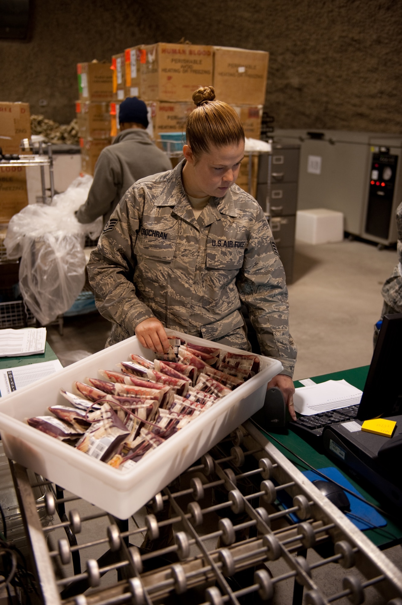 Staff Sgt. Kristy Crochran, 379th Blood Transshipment Center NCO in-charge, prepares blood for shipment, Sept. 9, in Southwest Asia. The 379 BTC provides blood and blood products to the U.S. Central Command area of responsibility, Horn of Africa and Naval ships to ensure these facilities have the blood supply they need. Sergeant Crochran is deployed from Langley Air Force Base, Va., in support of Operations Iraqi and Enduring Freedom. (U.S. Air Force Photo/Staff Sgt. Robert Barney)