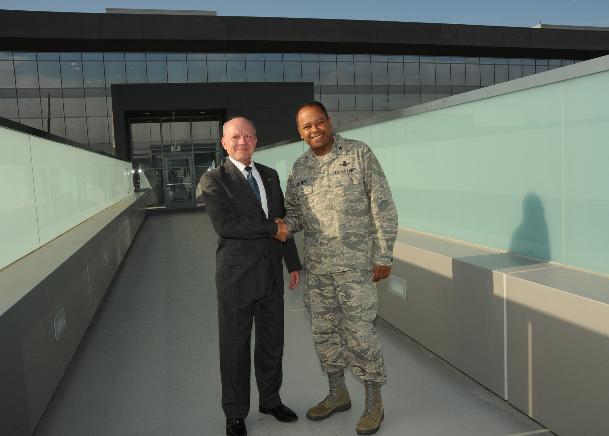 Dr. David Gorney, The Aerospace Corporation's Space Systems Group senior vice president, and Brig. Gen. Samuel Greaves, Space and Missile Systems Center vice commander, mark the completion of the new pedestrian bridge across El Segundo Blvd. linking Los Angeles Air Force Base and Aerospace's campus, Aug. 28.  A formal ceremony dedicating the bridge is scheduled for 11 a.m., Sept.  29 at base of the stairs on the Aerospace side. All base personnel are invited to attend. (Photo by Lou Hernandez)