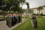 Tech. Sgt. Matt Hannen (ladder), Air Force Photojournalist assigned to Torch Magazine, Headquarters Air Education and Training Command, coordinates a photograph of Headquarters Safety Directorate staff members for a marketing poster themed "Mishap Prevention Starts Here" for distribution command-wide, and throughout the Air Force. (U.S. Air Force photo/Steve Thurow)