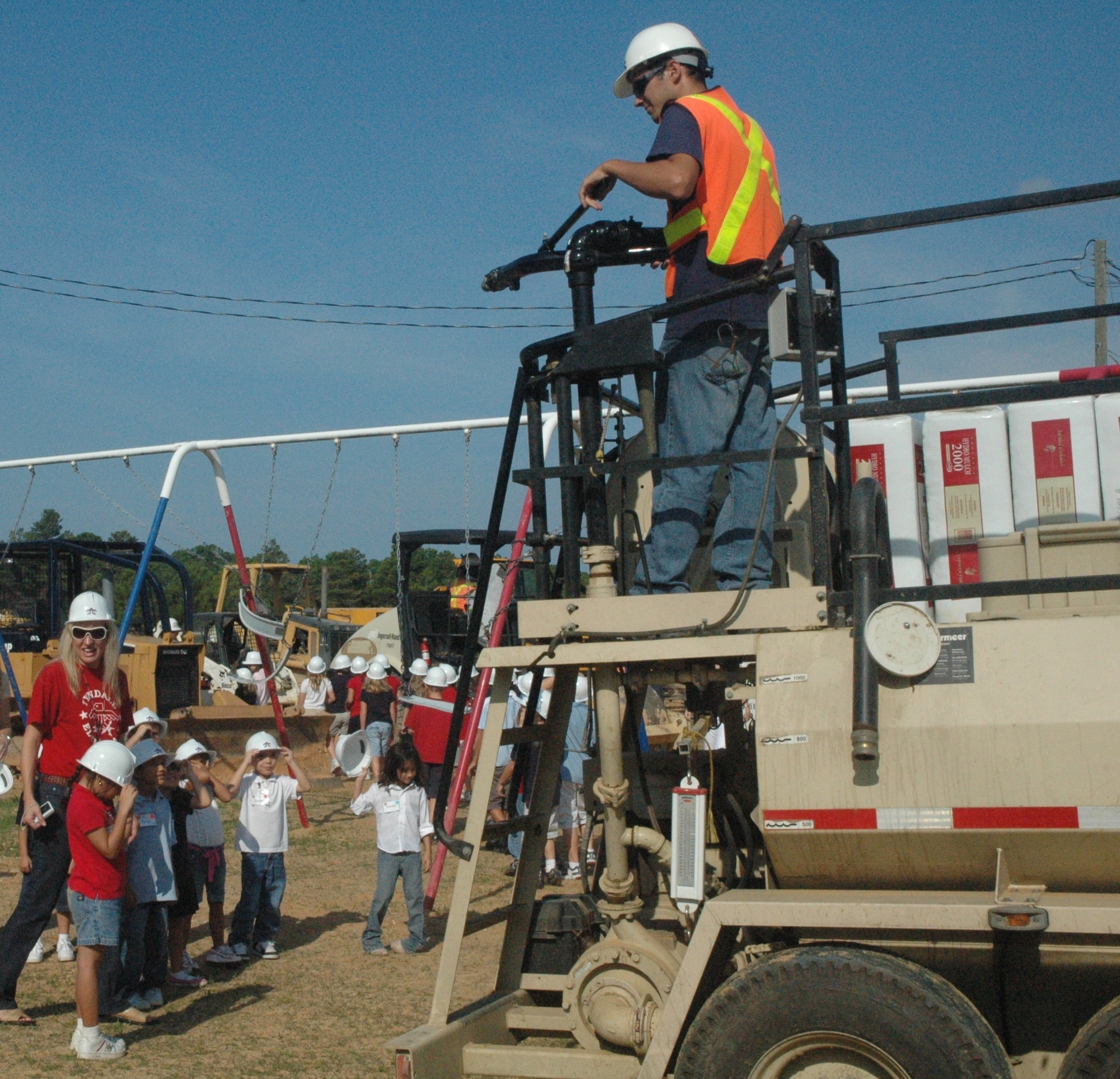 Tyndall Elementary students from kindergarten to fifth grade explore construction equipment outside the school Sept. 10.  The children and staff all wore thunderbird hard hats to witness the heavy machinery in action.   (U.S. Air Force photo/Airman 1st Class Veronica McMahon)  