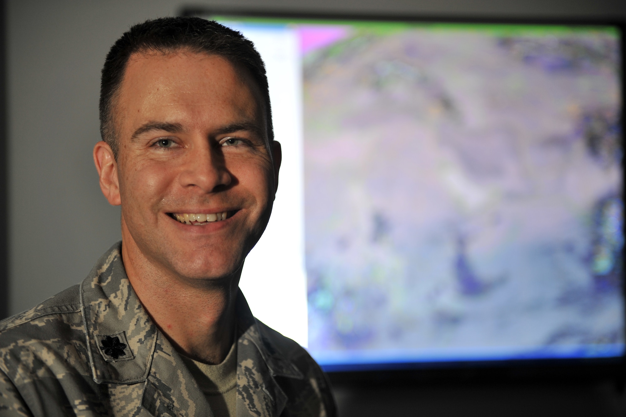 SHAW AIR FORCE BASE, S.C. -- Lieutenant Col. William Pryor, 28th Operational Weather Squadron's new commander, poses in front of a weather map, Sept. 3. "This is an excellent squadron," he announced. "My goal is to sustain the excellence and set conditions where all Team 28 Airmen can reach their full potential.". (U.S. Air Force photo/Senior Airman Kathrine McDowell)
