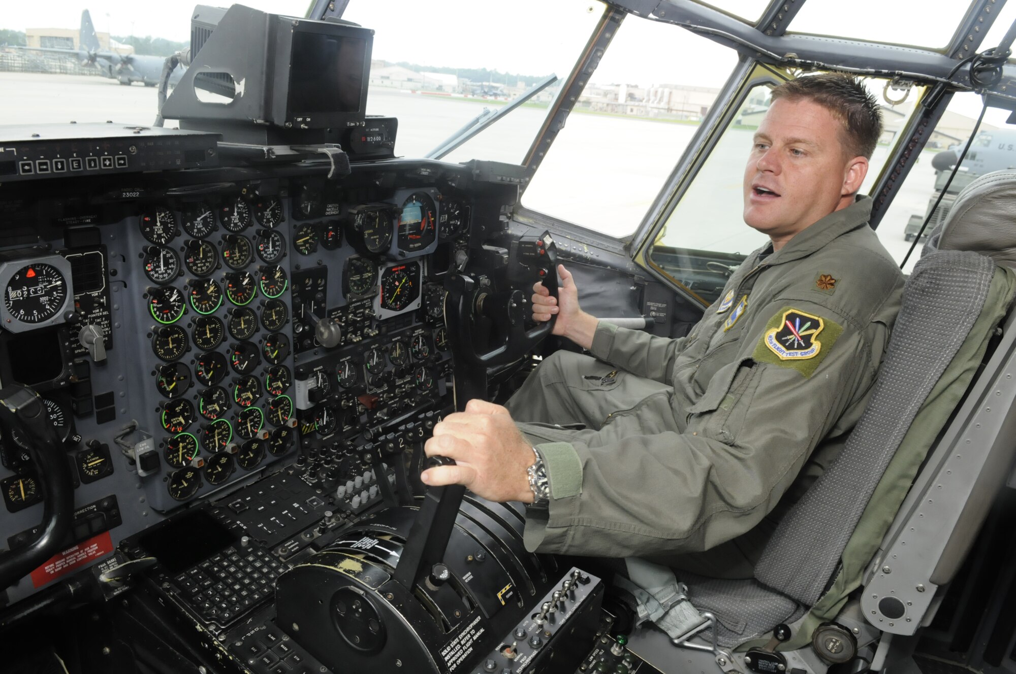 Maj. Jeremy Mickelson, C-130 pilot, talks from inside the cockpit of a C-130 that would be put through a functional test flight Sept. 1. U. S. Air Force photo by Sue Sapp