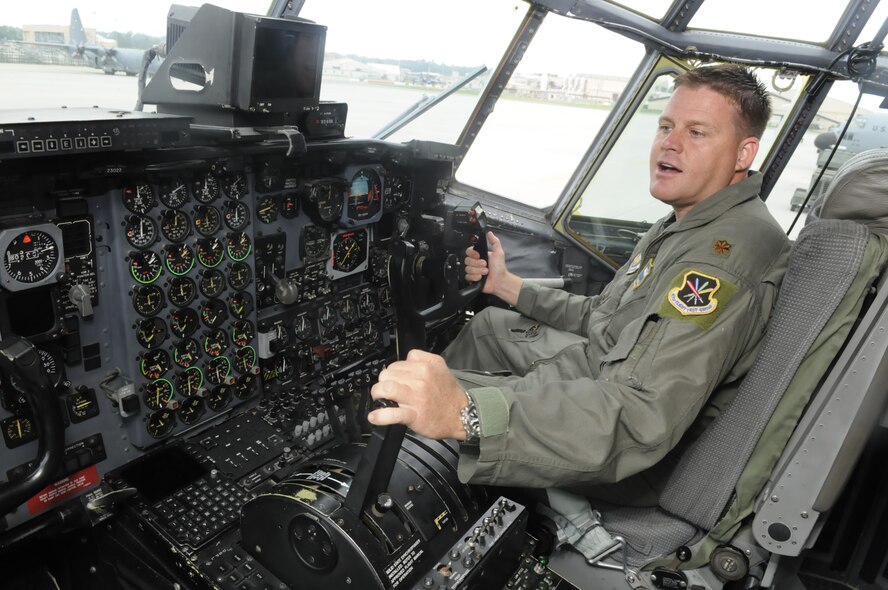 Maj. Jeremy Mickelson, C-130 pilot, talks from inside the cockpit of a C-130 that would be put through a functional test flight. (U. S. Air Force photo by Sue Sapp) 
