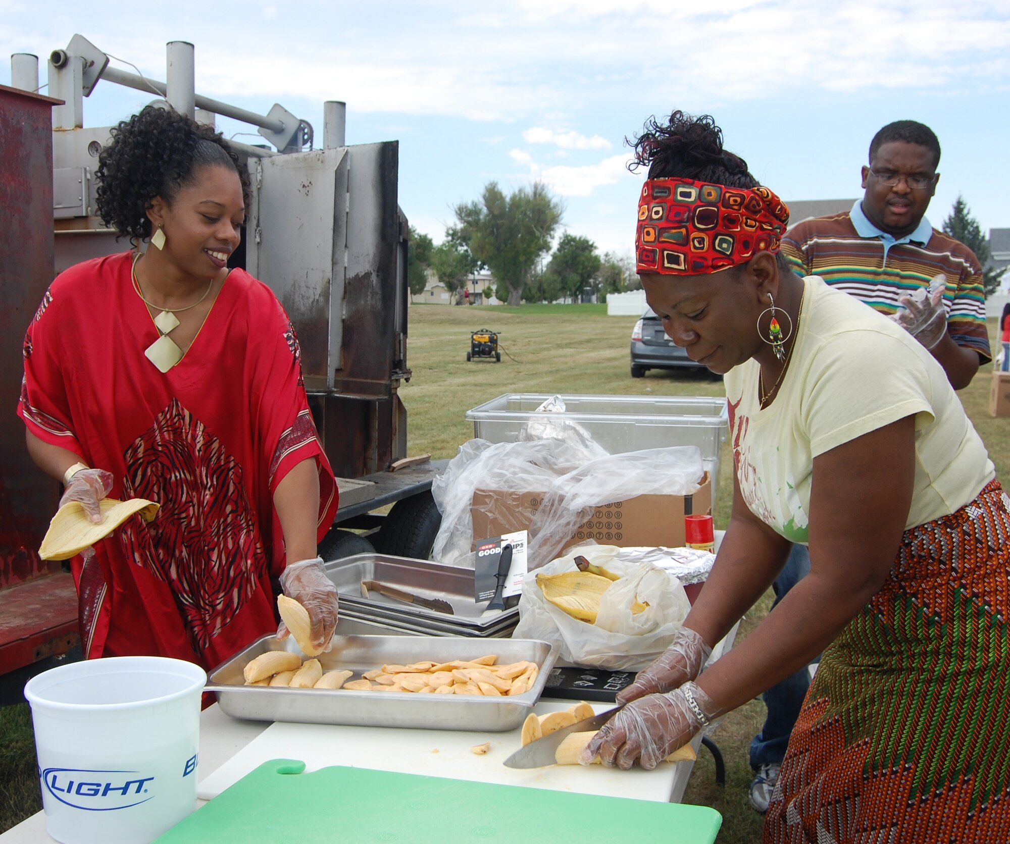 Staff Sgt. Felecia Jackson, 341st Force Support Squadron (left) and civilian Peggy Maximin, get plantains ready for the dish they would serve at the Multi-Cultural Celebration Sept. 3. More than 500 Team Malmstrom members attended the event at the Grizzly Bend Club. (U.S. Air Force photo/Valerie Mullett)