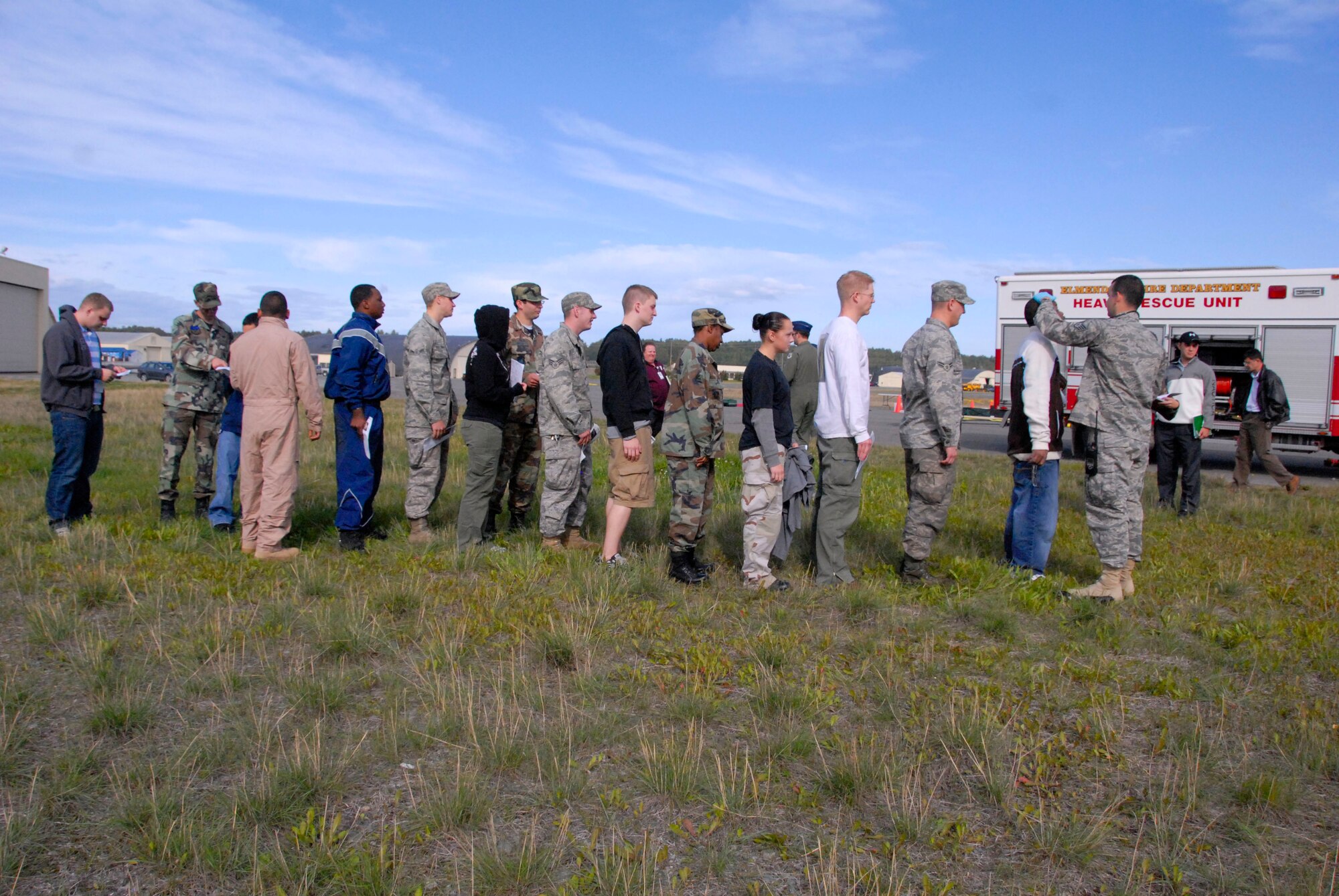 ELMENDORF AIR FORCE BASE, Alaska -- Exercise role players wait in line to be seen by the medical response team. "Victims" were asked to act as real as possible during the all hazards training exercise Sept. 9. (U.S. Air Force photo/Senior Airman Cynthia Spalding)