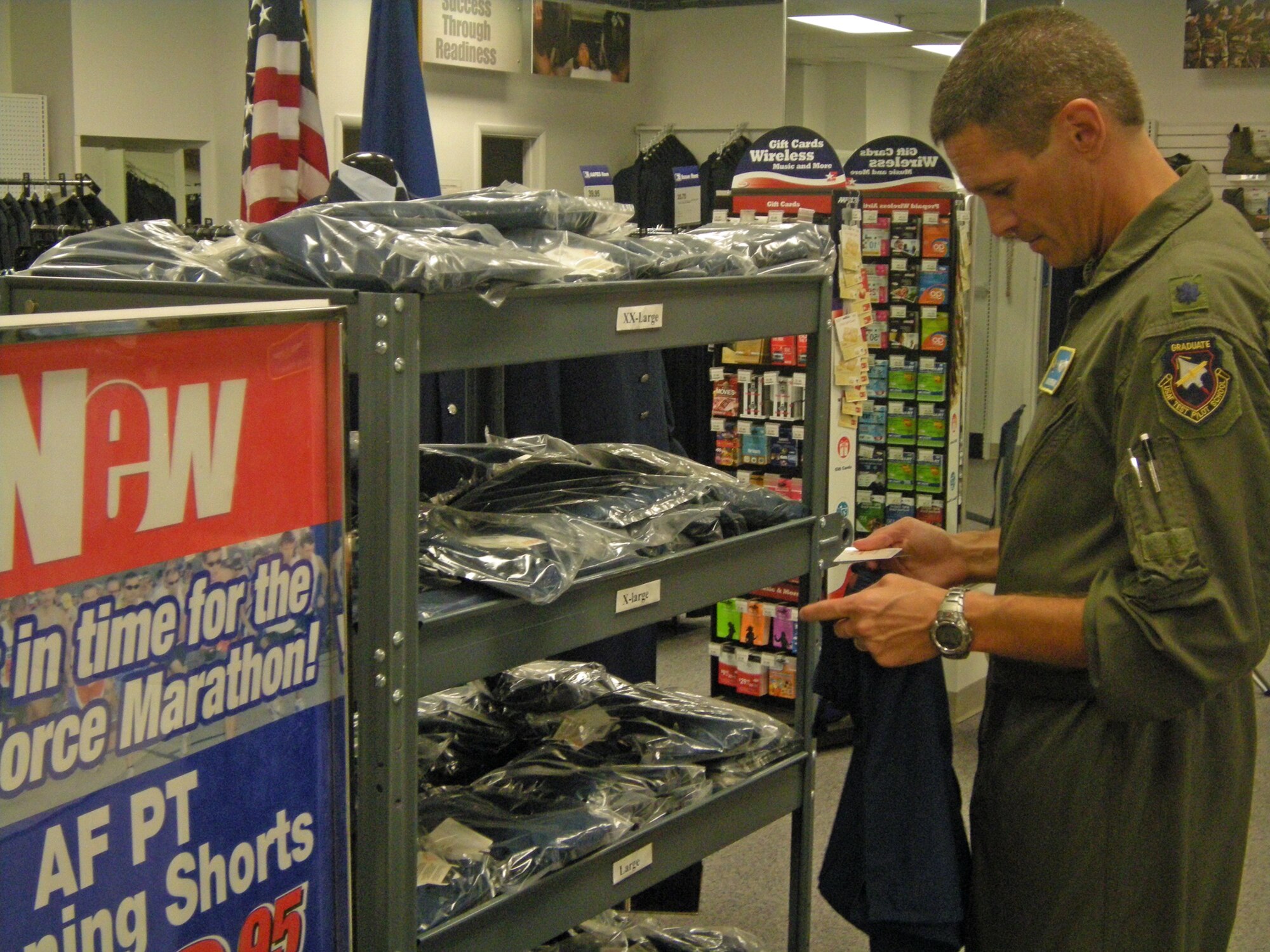 Lt. Col. Adam Remaly checks out the new Air Force PT running shorts at the Wright-Patterson Air Force Base Military Clothing Sales Store. The new short costs $16.95 and is available only from the Army and Air Force Exchange Service MCSS.   Lt. Col. Remaly is an engineer with the 77th Aeronautical Systems Wing. (Air Force photo/Derek Kaufman)