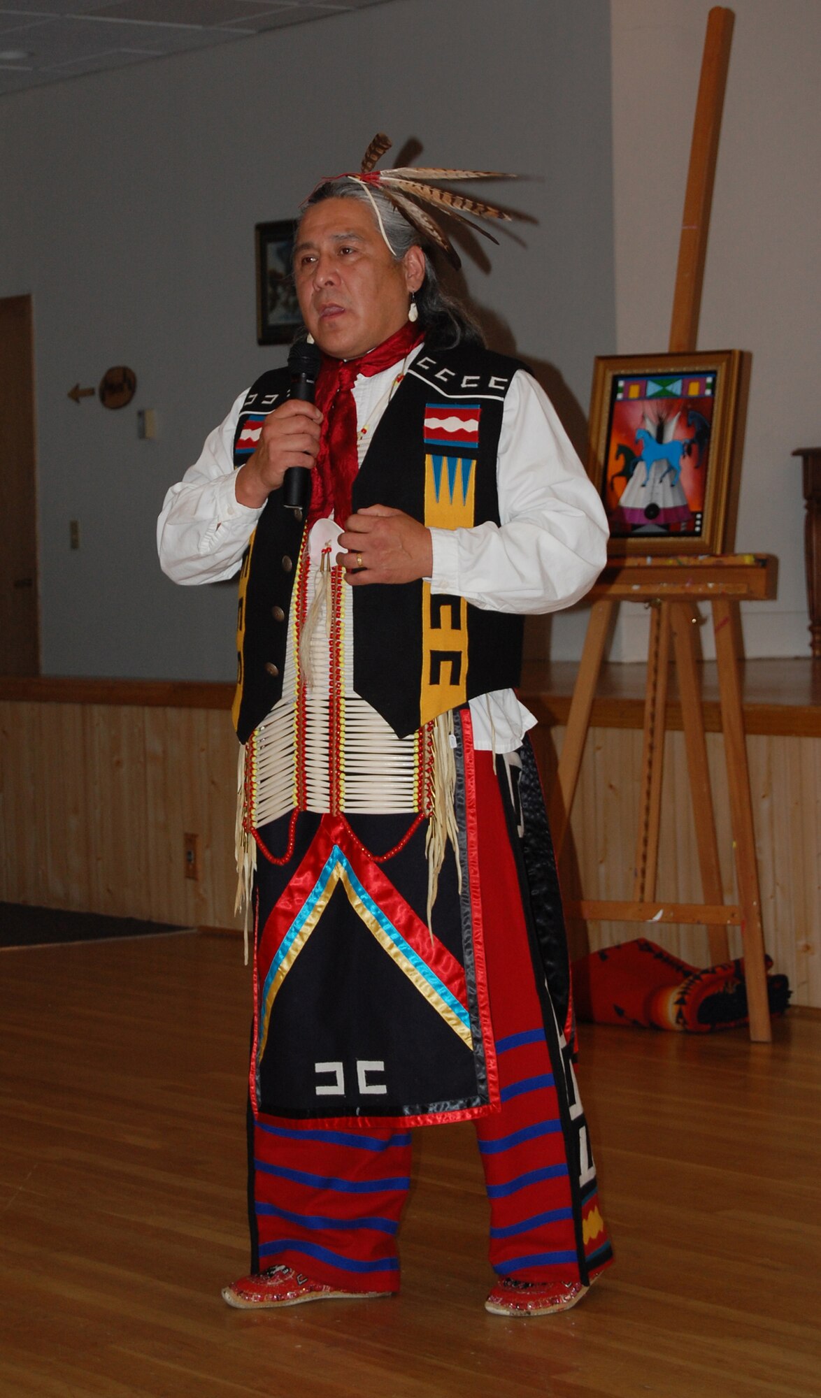 Monte Yellow Bird, whose Native American name is Black Pinto Horse, tells the story of how he received this name to Team Malmstrom members during the Multi-Cultural Celebration Sept. 3. His storytelling was one of many featured events along with hula dancers, Scottish bagpipers and a judo demonstration, to name a few. (U.S. Air Force photo/Valerie Mullett)