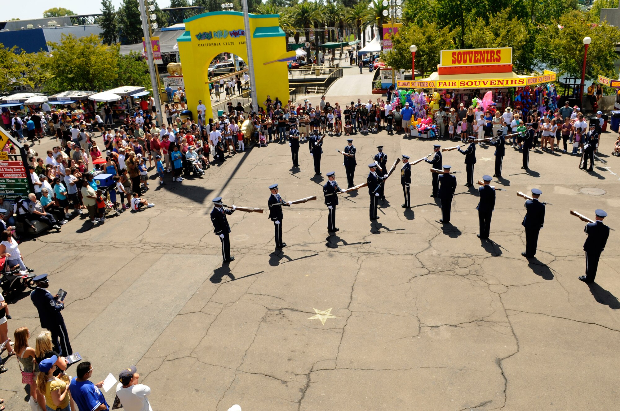 Members of the United States Air Force Honor Guard Drill Team execute their 16-man performance Sept. 5 at the California State fair in Sacramento. The Drill Team performed five times at the state fair which was attended by more than 675,000 people The Drill Team, the traveling component of the Honor Guard, tours around the world in order to recruit, retain, and inspire. (U.S. Air Force photo by Staff Sgt. Dan DeCook)