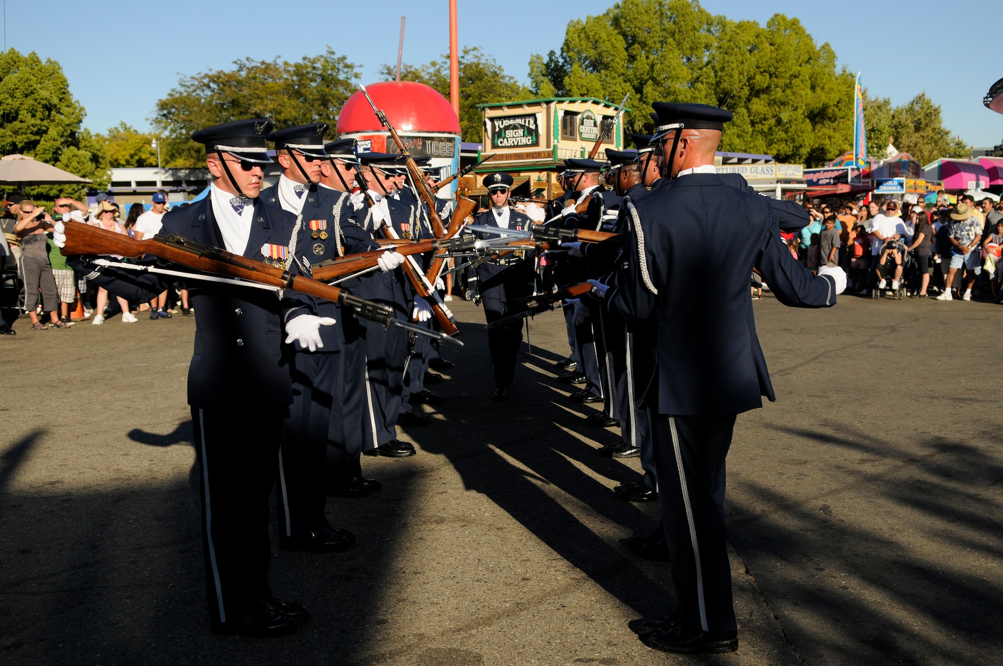 Capt. Michael Fanton, United States Air Force Honor Guard Drill Team commander, walks “the gauntlet” during the Drill Team’s 16-man performance Sept. 6 at the California State Fair in Sacramento. The Drill Team performed five times at the state fair which drew crowds of more than 675,000 people. The Drill Team, the traveling component of the Honor Guard, tours around the world in order to recruit, retain, and inspire. (U.S. Air Force photo by Staff Sgt. Dan DeCook)