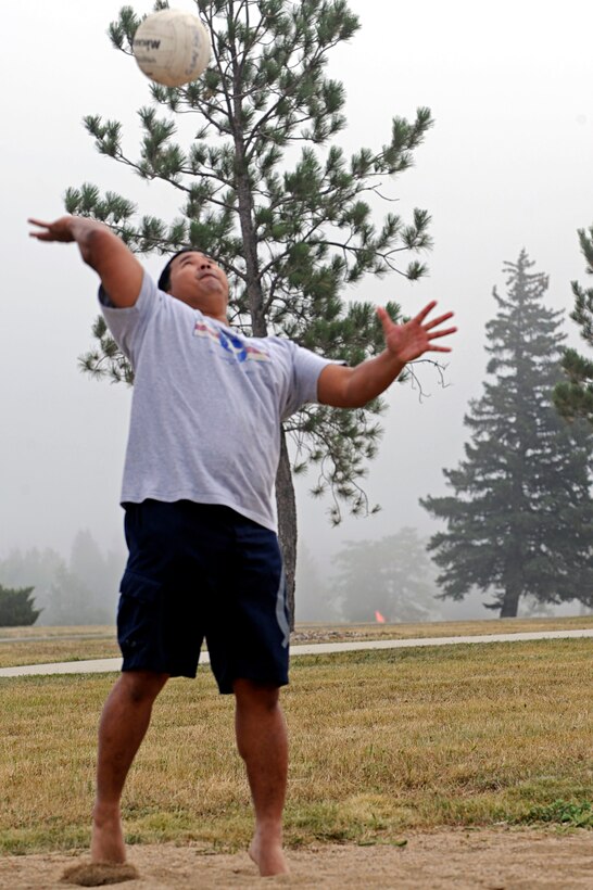 Tech. Sgt. Audy Doctora, 28th Force Support Squadron NCO in charge of the flight kitchen, serves during a game of blind volleyball during a base picnic here, Sept. 3. Multiple base organizations sponsored the picnic by providing volunteers, equipment, and food. (U.S. Air Force photo/Airman 1st Class Matthew Flynn)