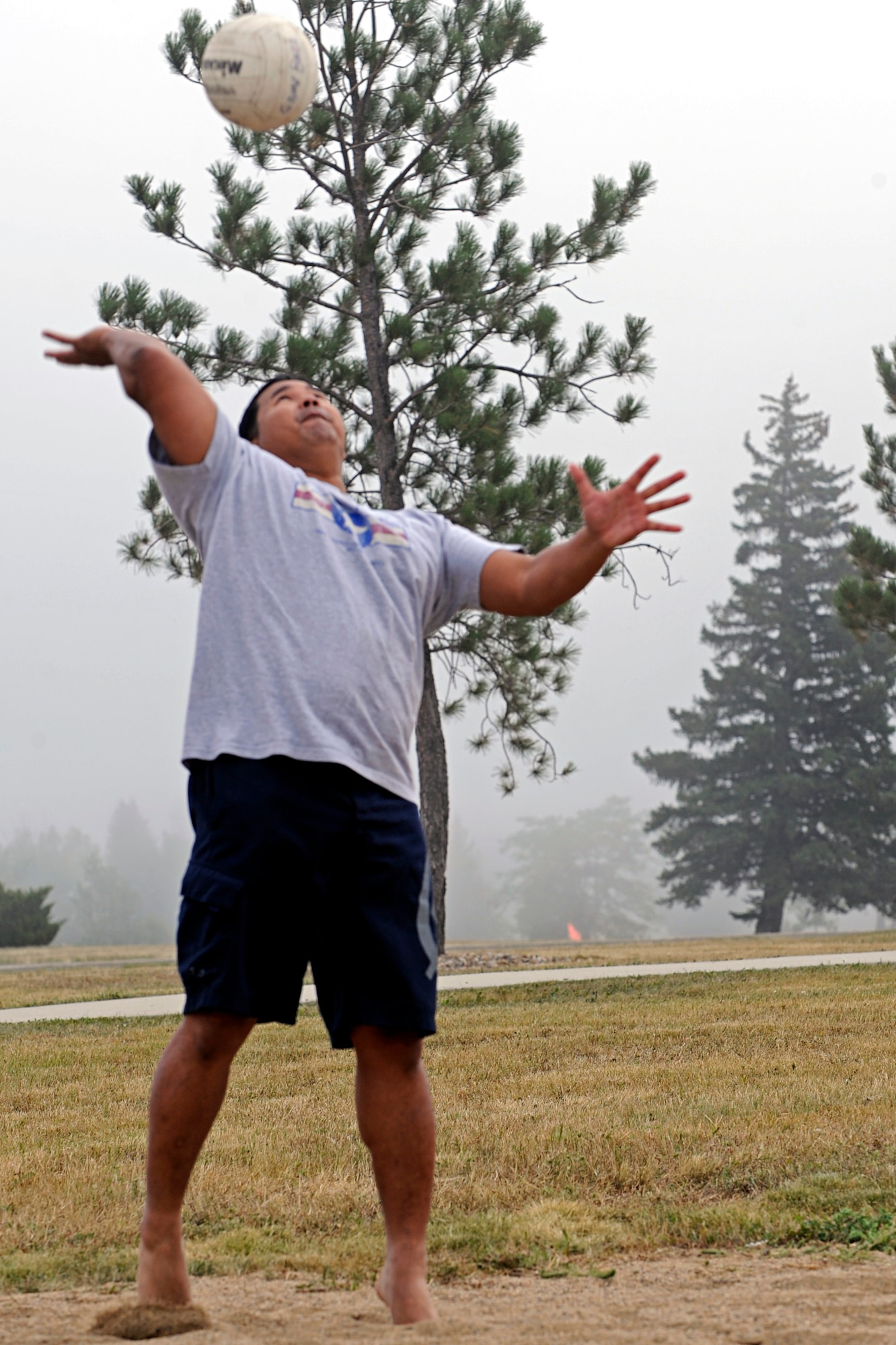 Tech. Sgt. Audy Doctora, 28th Force Support Squadron NCO in charge of the flight kitchen, serves during a game of blind volleyball during a base picnic here, Sept. 3. Multiple base organizations sponsored the picnic by providing volunteers, equipment, and food. (U.S. Air Force photo/Airman 1st Class Matthew Flynn)