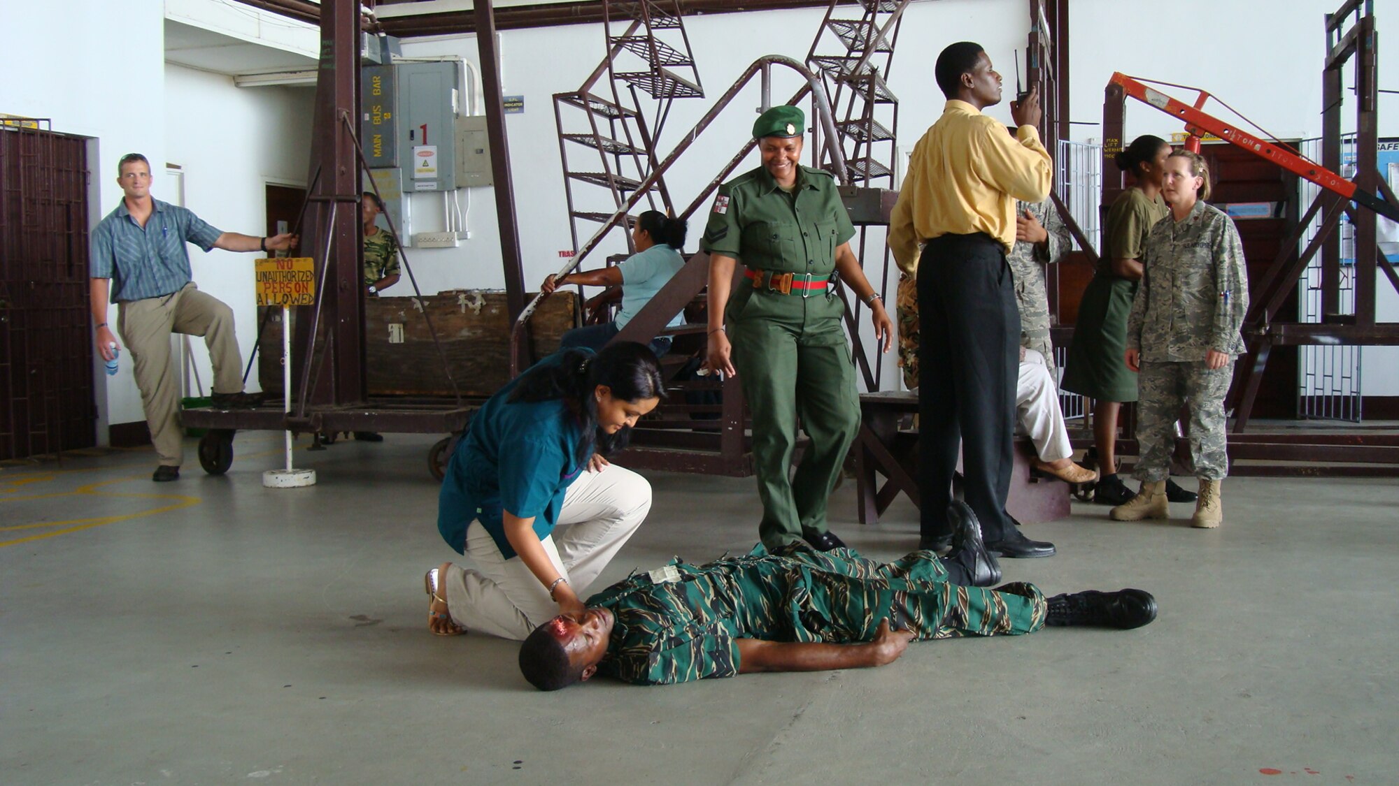 U. S. Air Force instructors from the Air Force DIMO team based at Brooks City-Base, Texas, conduct a mass casualty (MASCAL) exercise with first responders in Georgetown, Guyana. The exercise was part of a week-long first responder course that taught advanced medical techniques for emergencies to Guyana first responders. (Air Force photo)
