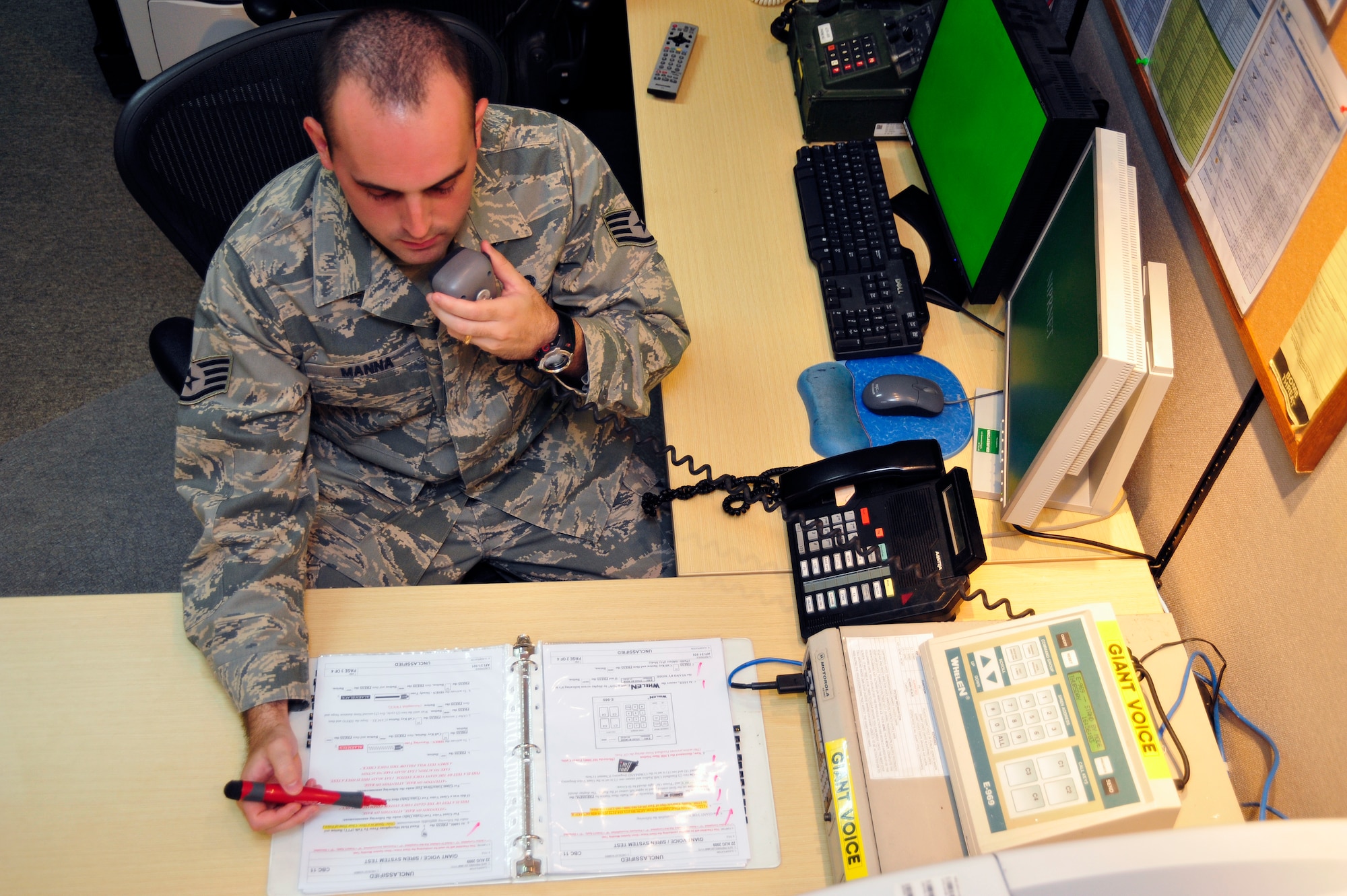 SOUTHWEST ASIA -Staff Sgt. Sebastian Manna, 380th Air Expeditionary Wing, performs an operational check of the giant voice system Sept. 10, 2009. Sergeant Manna is deployed from Ramstein Air Base, Germany, and hails from Buenos Aires, Argentina. (U.S. Air Force photo/Tech. Sgt. Charles Larkin Sr)