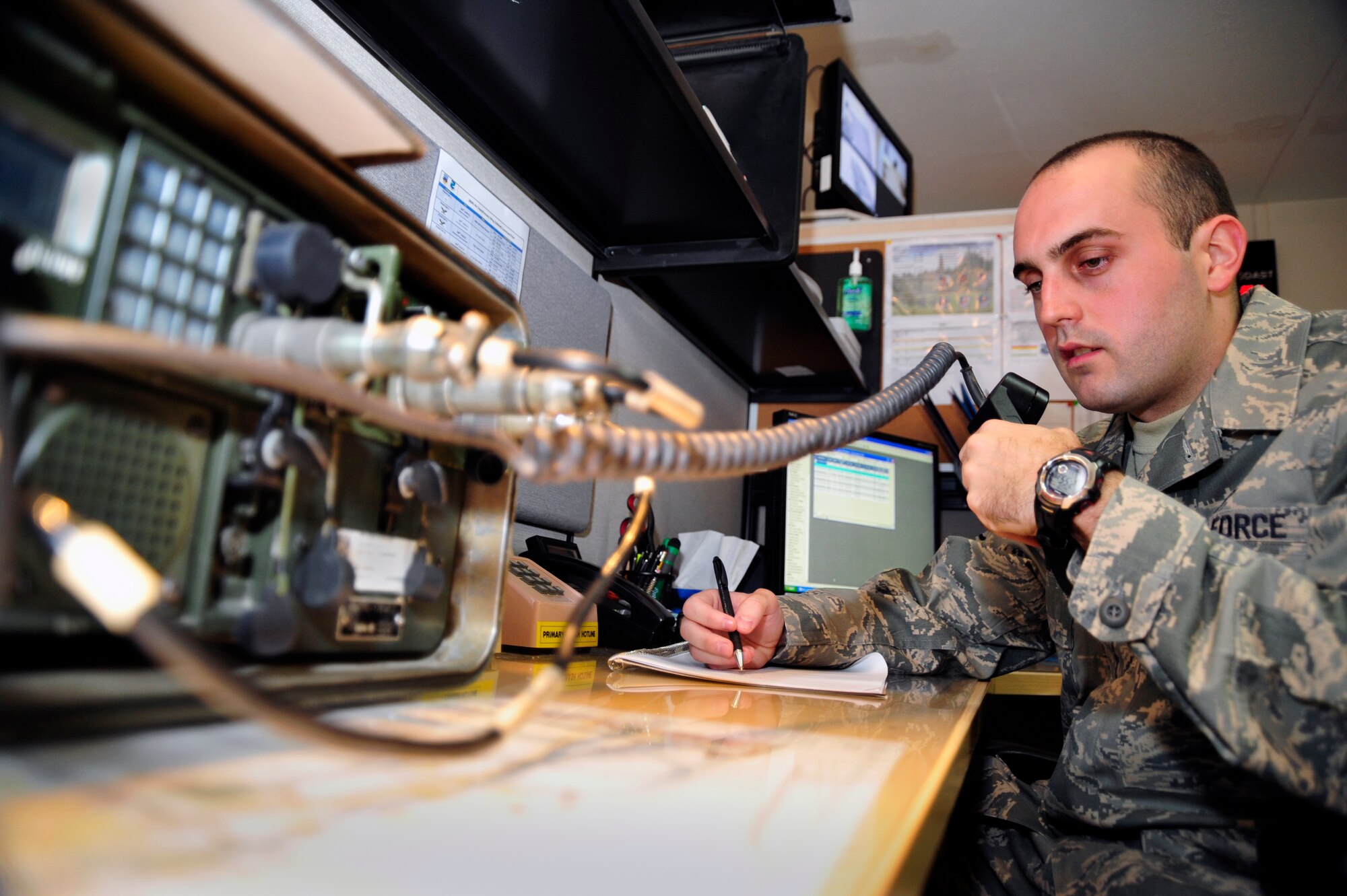 SOUTHWEST ASIA -Staff Sgt. Sebastian Manna, 380th Air Expeditionary Wing, communicates with aircraft while on duty in the command post Sept. 10, 2009. Sergeant Manna is deployed from Ramstein Air Base, Germany, and grew up in Buenos Aires, Argentina. (U.S. Air Force photo/Tech. Sgt. Charles Larkin Sr)