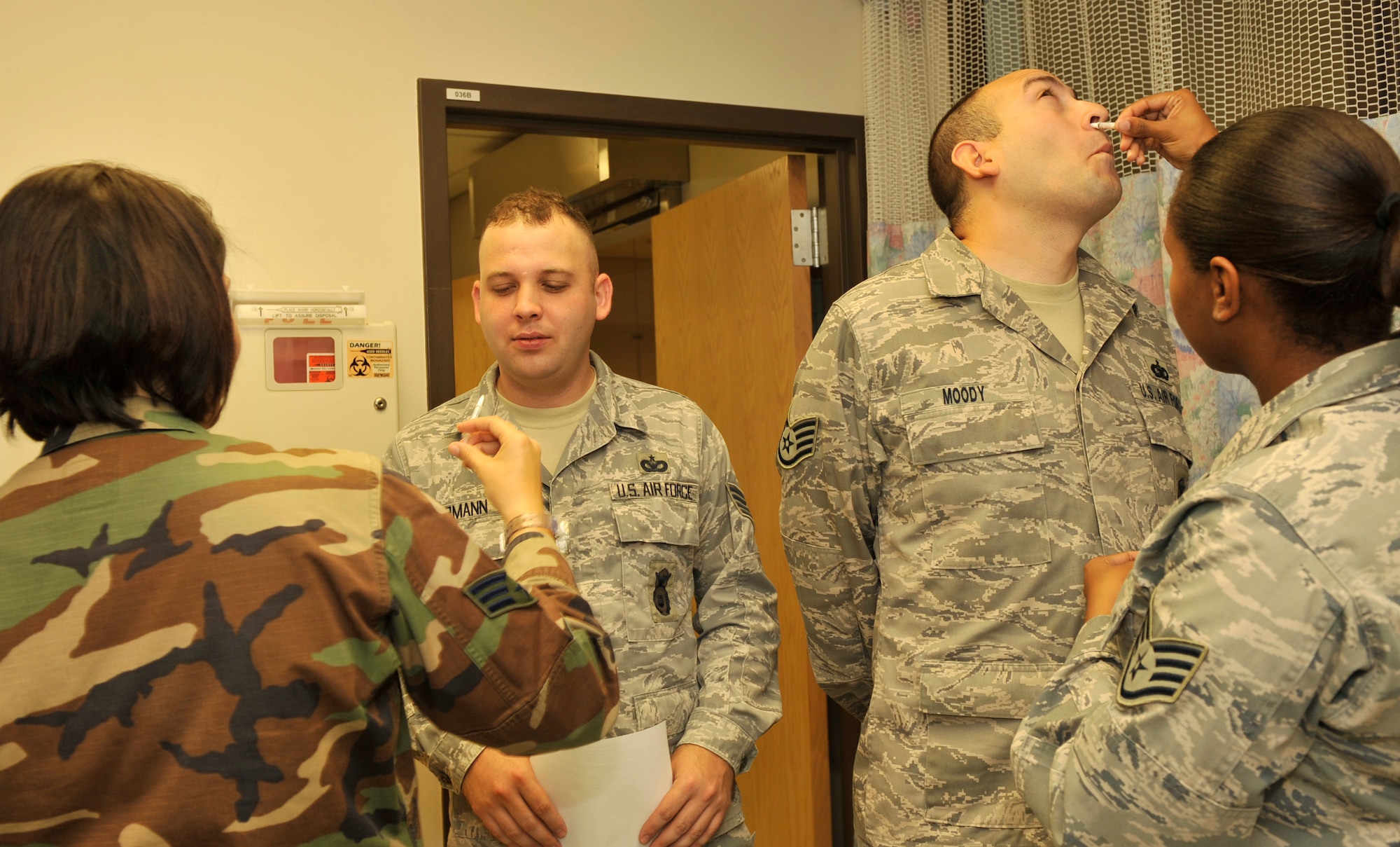 MOODY AIR FORCE BASE, Ga. – Technicians from the 23rd Medical Group Immunizations Clinic administers the intranasal FluMist to Moody Airmen here Sept. 9. Department of Defense policy states that the influenza vaccination is mandatory for all active duty, Guard and Reserve personnel. (U.S. Air Force photo by Senior Airman Schelli Jones)
