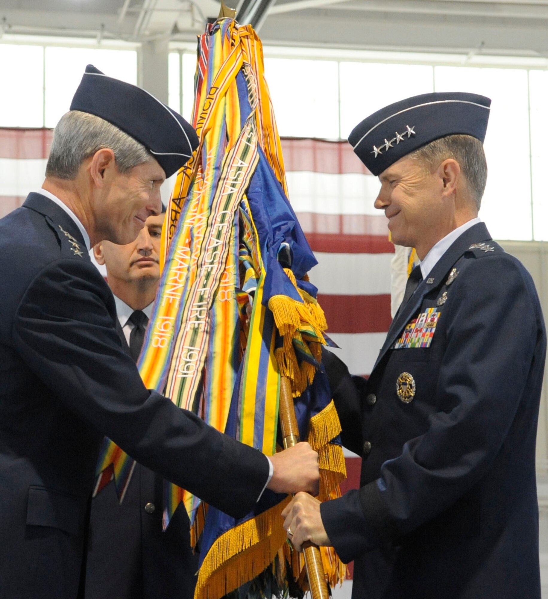 LANGLEY AIR FORCE BASE, Va.-- Gen. William M. Fraser III assumes command of the Air Combat Command by accepting the guidon from Gen. Norton A. Schwartz, who was Chief of Staff of the Air Force at the time, during the change of command ceremony here Sept. 10.  General Fraser came from the Pentagon, where he served as the Air Force Vice Chief of Staff.  He was selected to command ACC after Gen. John D.W. Corley announced his retirement in May.  (U.S. Air Force photo/Senior Airman Dana Hill)