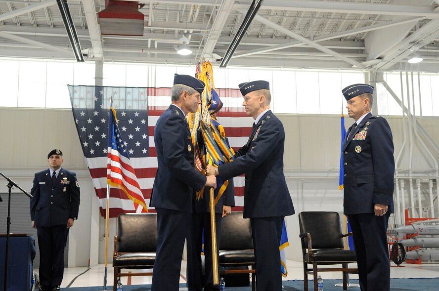 LANGLEY AIR FORCE BASE, Va.-- Gen. John D.W. Corley relinquishes command of the Air Combat Command by passing the guidon to Gen. Norton A. Schwartz, who was Chief of Staff of the Air Force at the time, during the change of command ceremony here Sept. 10.  General Corley relinquished command to Gen. William M. Fraser III after commanding ACC since October 2007 and serving his country for more than 36 years.  (U.S. Air Force photo/Senior Airman Dana Hill)