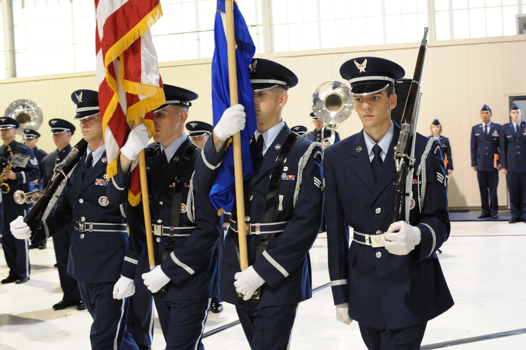LANGLEY AIR FORCE BASE, Va. – Langley Honor Guard members, Senior Airman Eric Holland, 10th Intelligence Squadron systems program manager, Senior Airman Adam Underwood, 27th IS war operations center controller, Senior Airman Joshua Chevalier, 1st Equipment Maintenance Squadron aircraft armament systems journeyman, and Senior Airman Howard Philip, 82nd Communications Support Squadron systems administrator, present the Colors during the Air Combat Command change-of-command ceremony in the 71st Fighter Squadron hangar Sept. 10. Gen. John D.W. Corley relinquished command to Gen. William M. Fraser III after commanding ACC since October 2007 and serving his country for more than 36 years.  (U.S. Air Force photo/Staff Sgt. Barry Loo)