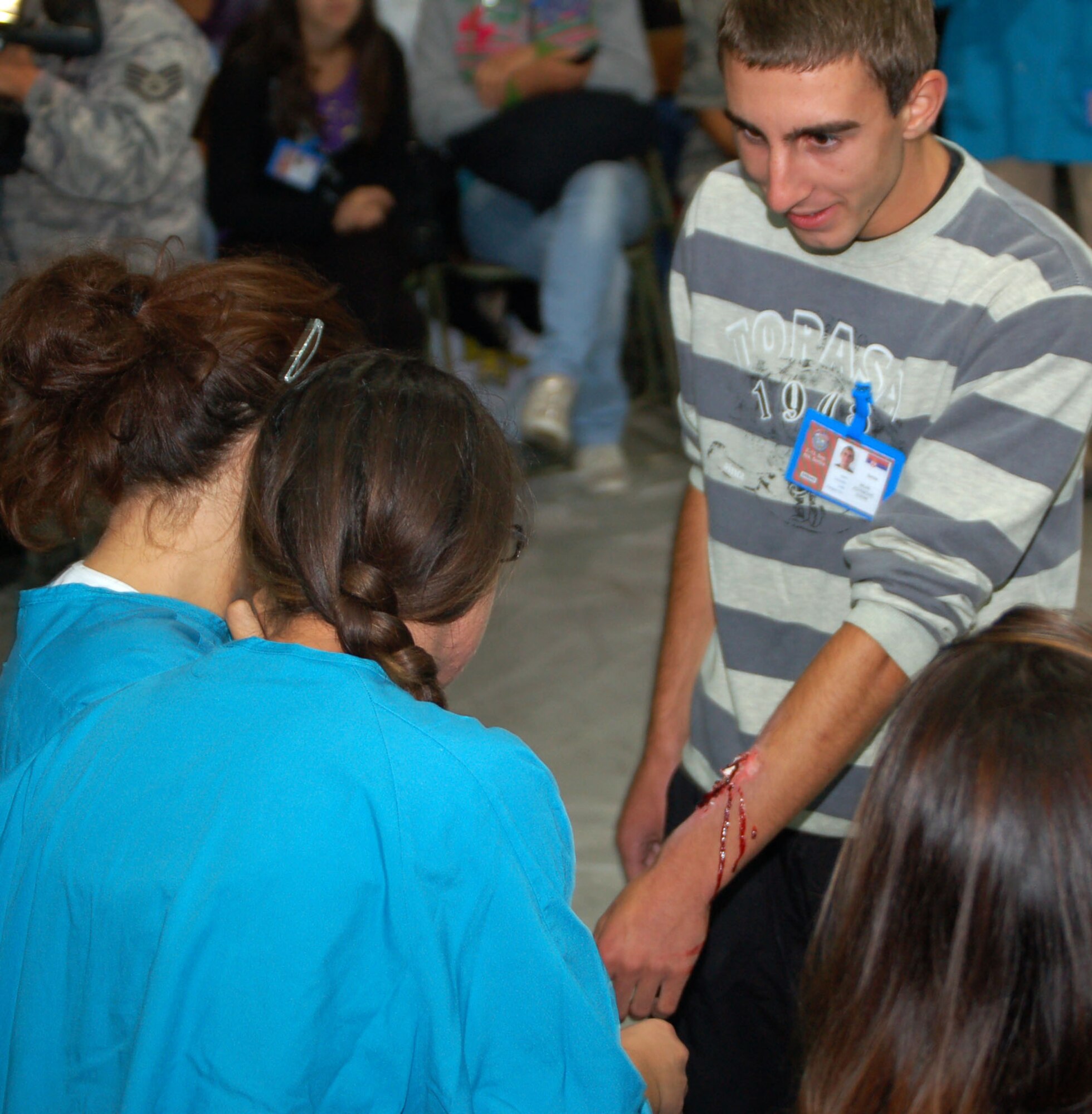 NIS, Serbia – Milan Jovanovic, medical student at Dr. Milenko Hadzic Medical School here, shows off a mock open fracture to his classmates Sept. 8 during moulage training conducted by members of the 86th Medical Group from Ramstein Air Base, Germany. Fifty students from the school participated as “casualties” in the live exercise portion of the military medical training exercise in Central and Easter Europe, or MEDCEUR 2009. (U.S. Air Force photo/Senior Airman Kali L. Gradishar)