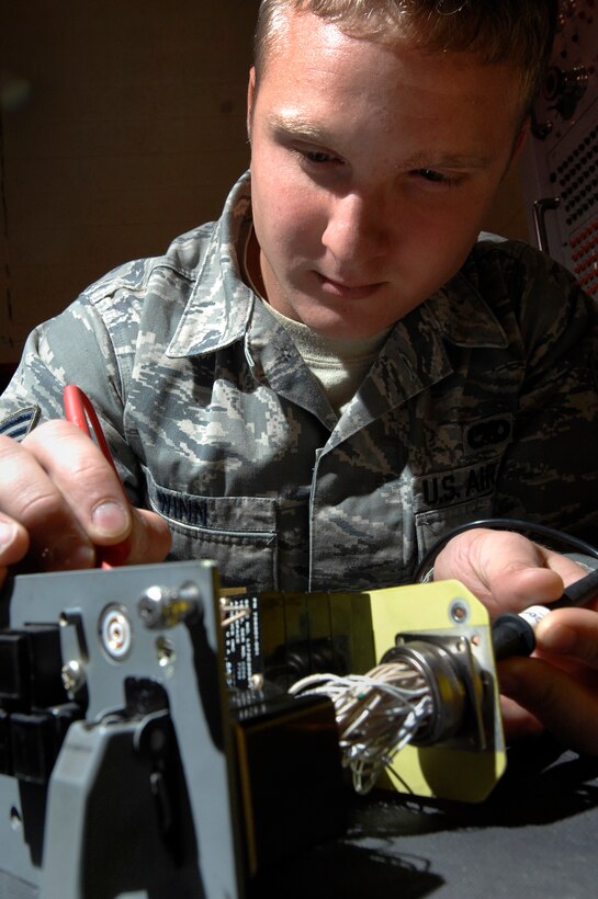 Senior Airman Coty Winn, 28th Maintenance Squadron aircraft electrical and environmental specialist, tests the continuity of switches on a landing gear control panel here, September 9. The work that the electrical and environmental shop completes saves the Air Force approximately $6.3 million annually. (U.S. Air Force photo/Airman 1st Class Joshua J. Seybert)
