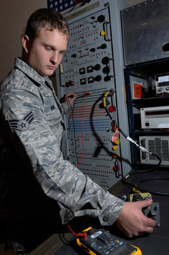 Senior Airman Coty Winn, 28th Maintenance Squadron aircraft electrical and environmental specialist, uses the panel test set to test the continuity of switches on a landing gear control panel here, September 9. The panel test set allows Airmen to test several wires at once rather than checking them one at a time. (U.S. Air Force photo/Airman 1st Class Joshua J. Seybert)