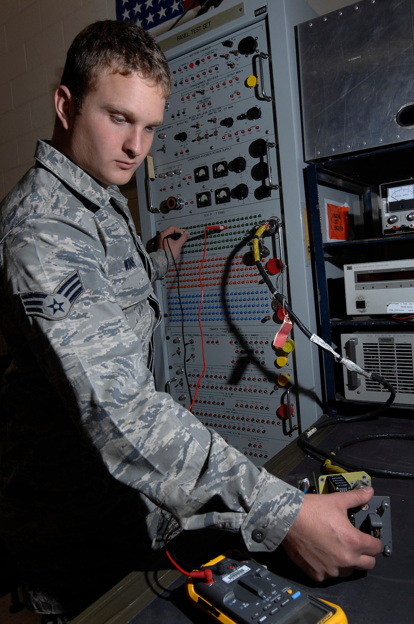 Senior Airman Coty Winn, 28th Maintenance Squadron aircraft electrical and environmental specialist, uses the panel test set to test the continuity of switches on a landing gear control panel here, September 9. The panel test set allows Airmen to test several wires at once rather than checking them one at a time. (U.S. Air Force photo/Airman 1st Class Joshua J. Seybert)