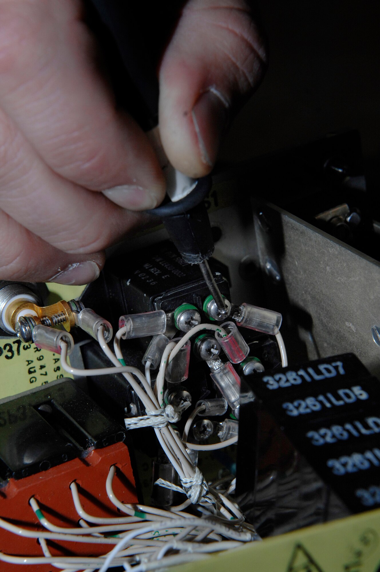 The continuity of switches on a landing gear control panel is tested by Senior Airman Coty Winn, 28th Maintenance Squadron electrical and environmental specialist, here, September 9. The landing gear control panel tells pilots the positioning of the landing gear. (U.S. Air Force photo/Airman 1st Class Joshua J. Seybert)