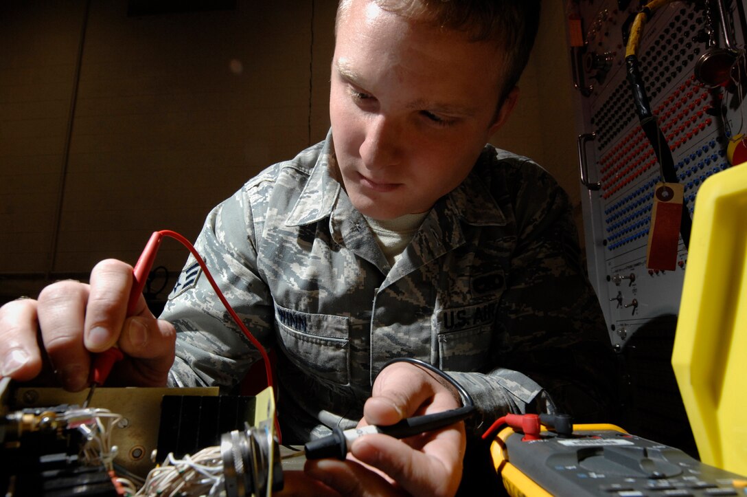 Senior Airman Coty Winn, 28th Maintenance Squadron aircraft electrical and environmental specialist, tests the continuity of switches on a landing gear control panel here, September 9. Testing the continuity ensures the wires are all serviceable. (U.S. Air Force photo/Airman 1st Class Joshua J. Seybert)