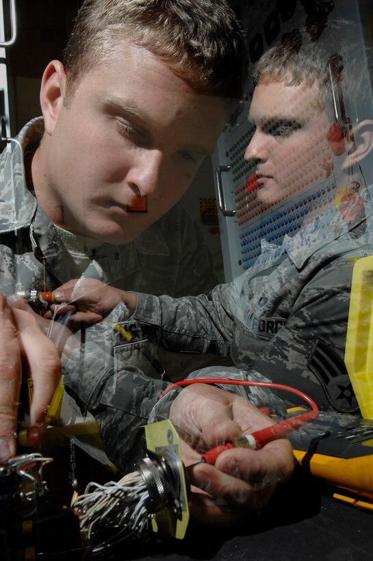 Senior Airman Coty Winn, 28th Maintenance Squadron aircraft electrical and environmental specialist, tests the continuity of switches on a landing gear control panel here, September 9. Airmen can test the landing gear continuity manually and through a machine called the panel test set. (U.S. Air Force photo/Airman 1st Class Joshua J. Seybert)