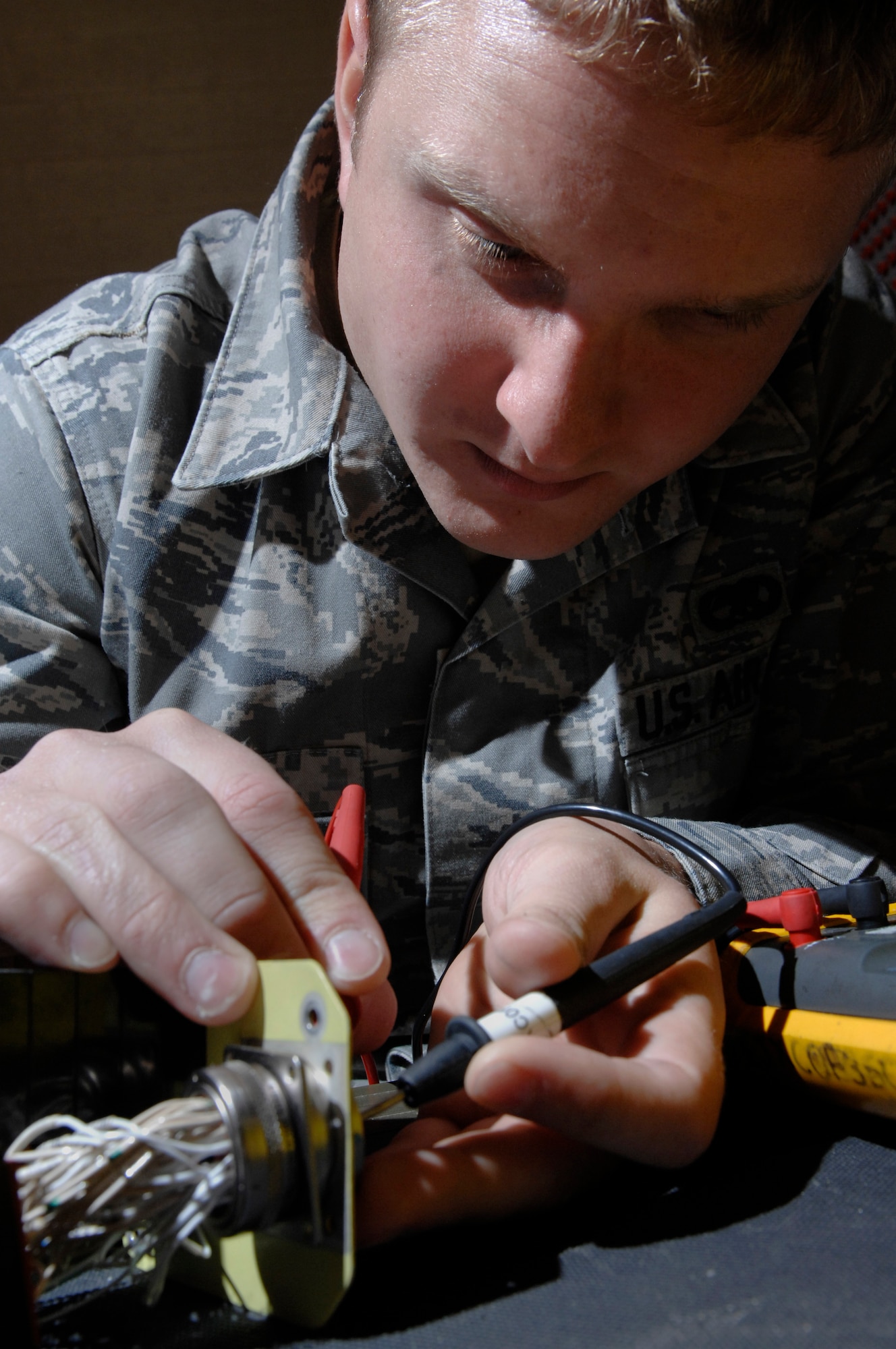 Senior Airman Coty Winn, 28th Maintenance Squadron aircraft electrical and environmental specialist, tests the continuity of switches on a landing gear control panel here, September 9. Testing the continuity ensures the wires are all serviceable. (U.S. Air Force photo/Airman 1st Class Joshua J. Seybert)