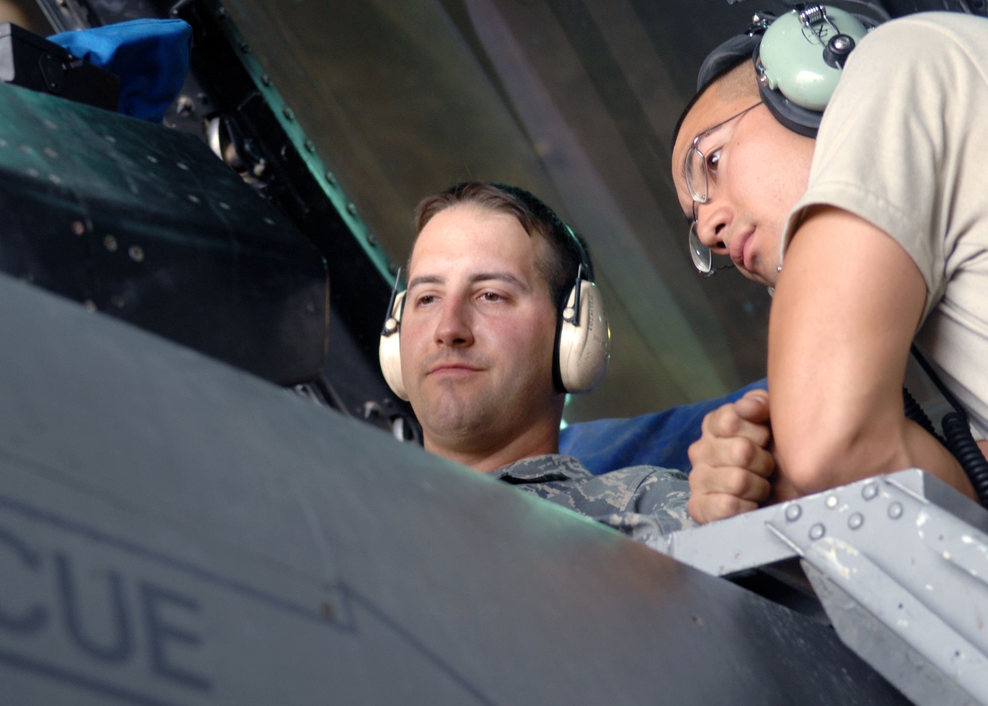 JOINT BASE BALAD, Iraq -- Staff Sgt. Chad Vaden and Senior Airman Mark Birrenkott, both avionics engineers with the 22nd Expeditionary Aircraft Maintenance Unit, conduct a power-on check to make sure all lights and gauges for the aircraft are functioning properly on an F-16 Fighting Falcon here Sep. 3. Sergeant Vaden and Airman Birrenkott are both deployed from Spangdahlem Air Force Base, Germany. (U.S. Air Force photo/Senior Airman Christopher Hubenthal)