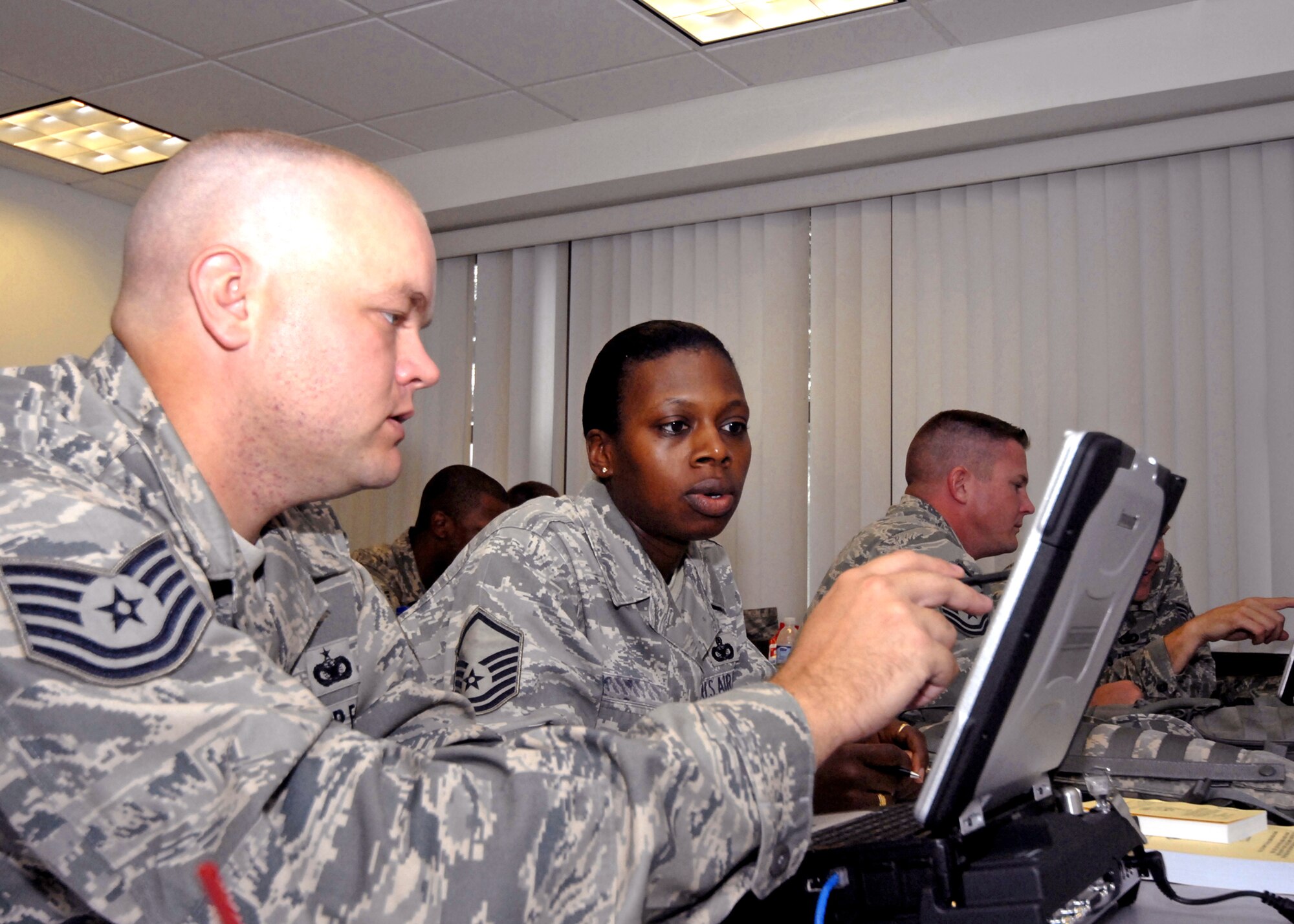 Security forces Airmen train on the Army's Blue Force Tracker system during their pre-deployment training at the Air Force Expeditionary Center's 421st Combat Training Squadron Aug. 29, 2009, at Joint Base McGuire-Dix-Lakehurst, N.J. The Blue Force Tracker is a system that gives air and ground units and their commanders a real-time picture of the battlefield. (U.S. Air Force photo/Tech. Sgt. Paul R. Evans) 
