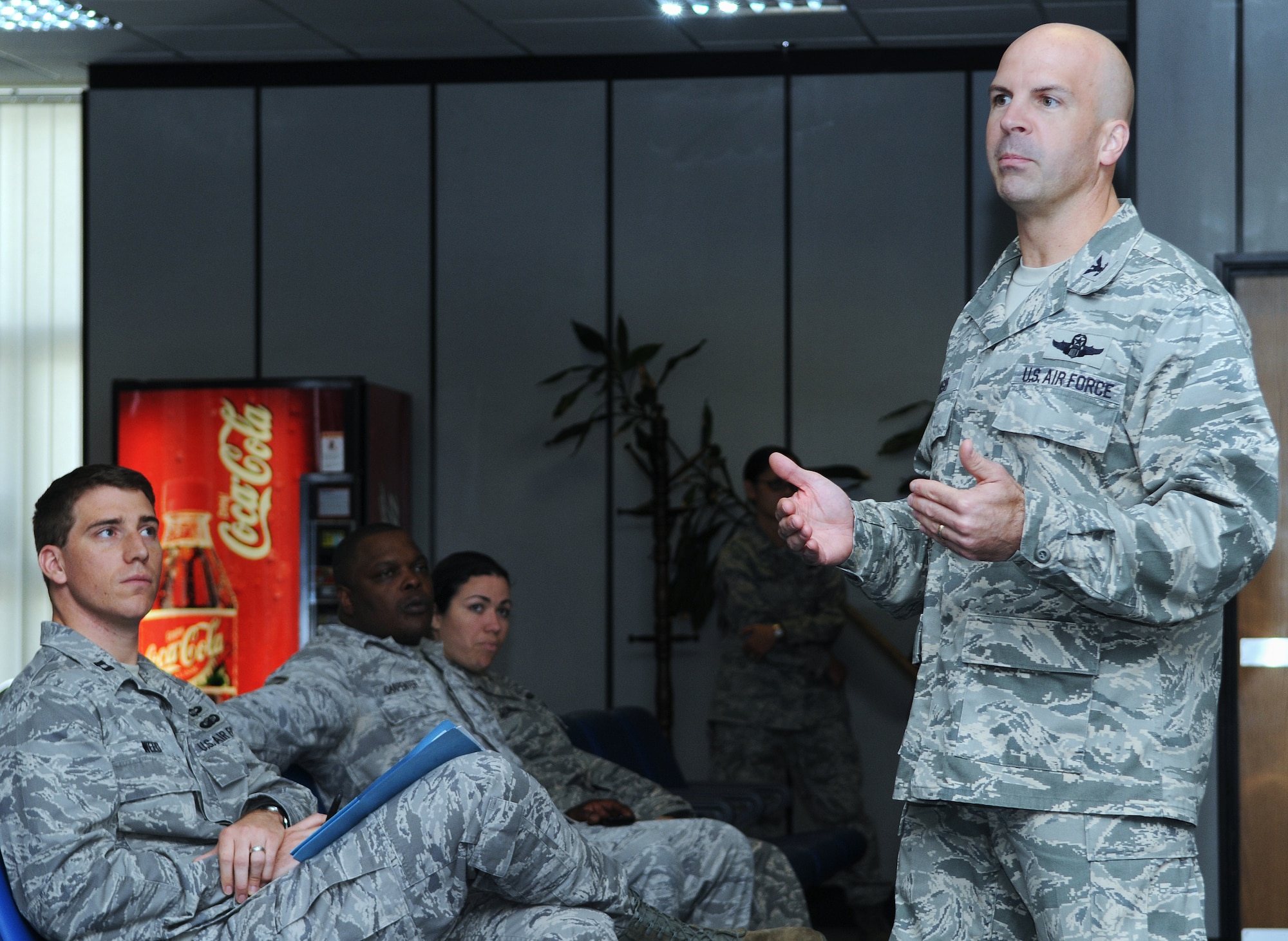 RAF MILDENHALL, England -- Col. Chad Manske, 100th Air Refueling Wing commander, speaks with wing staff agency members at one of a series of commander's calls where he shared his vision and priorities for the wing during the upcoming months. (U.S. Air Force photo/Senior Airman Thomas Trower)