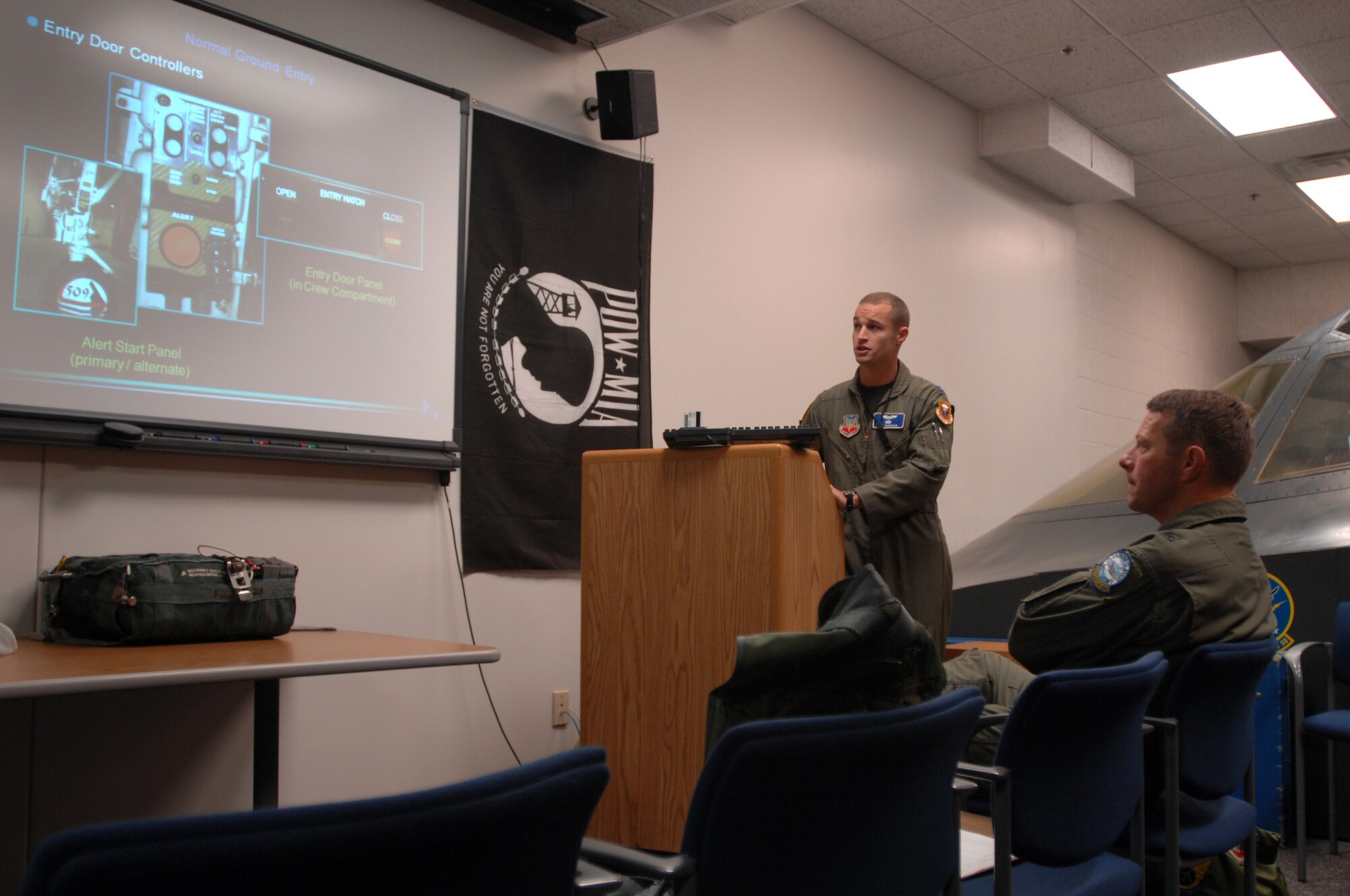 WHITEMAN AIR FORCE BASE, Mo. - Capt. Jay Morgan, 509th Operations Support Squadron egress instructor, gives Brig. Gen. Joseph Brown, deputy director for Nuclear Operations, U.S. Strategic Command, egress training prior to General Brown's first B-2 Spirit flight, Sept. 8. General Brown visited to Whiteman for three days to fly the B-2 Spirit and discuss nuclear operations and procedures with enlisted and officer personnel. (U.S. Air Force photo/Senior Airman Kenny Holston)