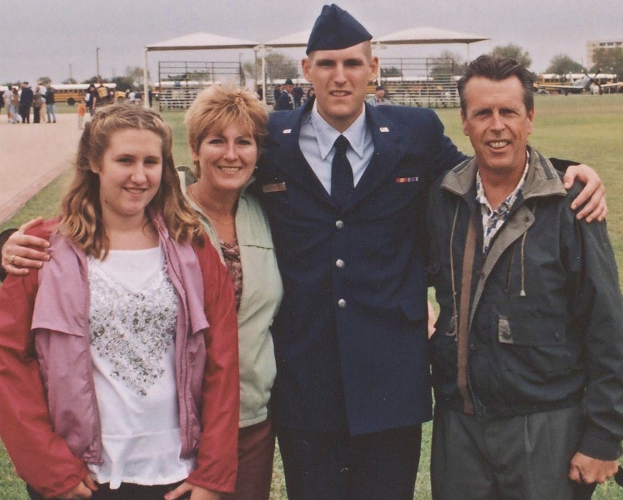 Senior Airman Matthew Schultz celebrates graduation from basic military training on a Lackland Air Force Base, Texas, parade field with his family. Airman Schultz, a 4th Component Maintenance Squadron aircrew egress journeyman assigned to Seymour Johnson Air Force Base, N.C., was killed in a vehicle accident September 5 while on leave. (Courtesy photo) 

